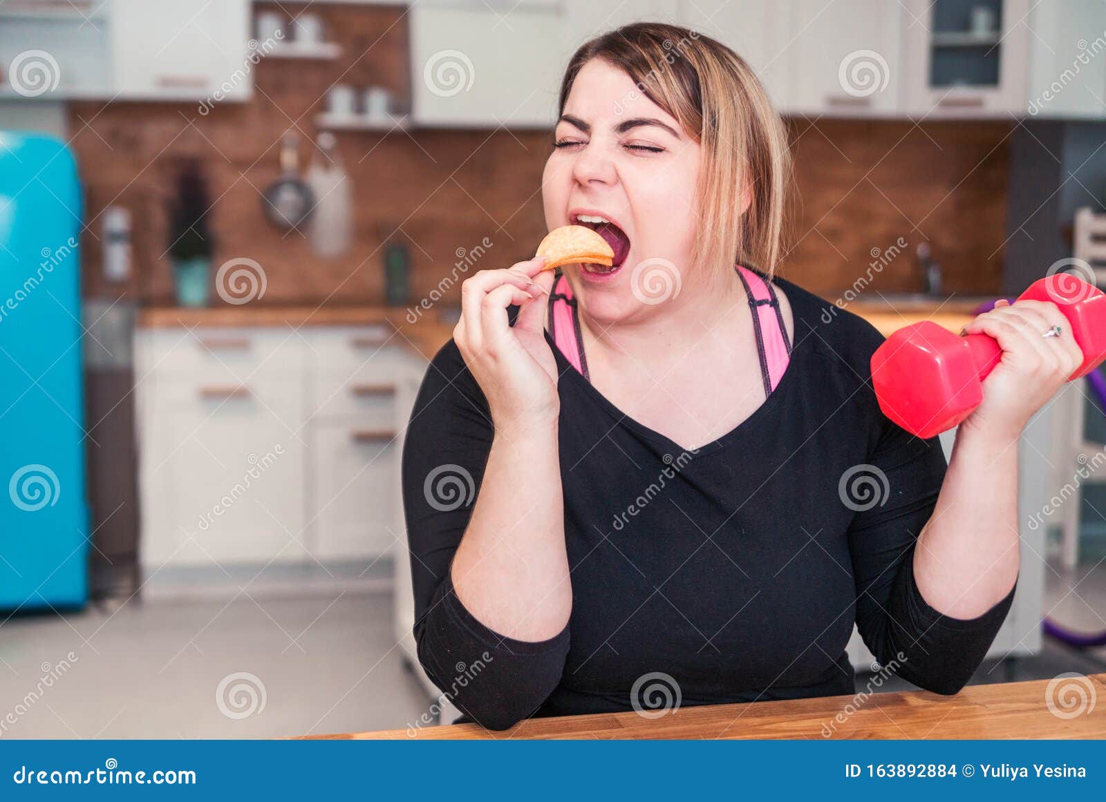 Fat Lazy Girl In Sportswear Eating Junk Food Instead Of Training Stock