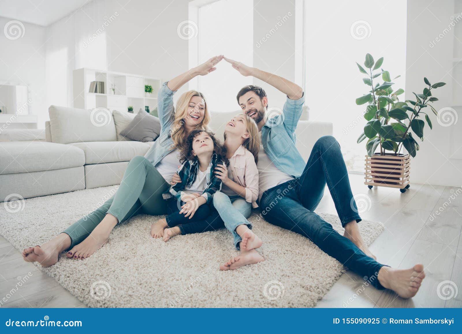 photo of foster family with two children moving new apartments making arms roof promise protection forever