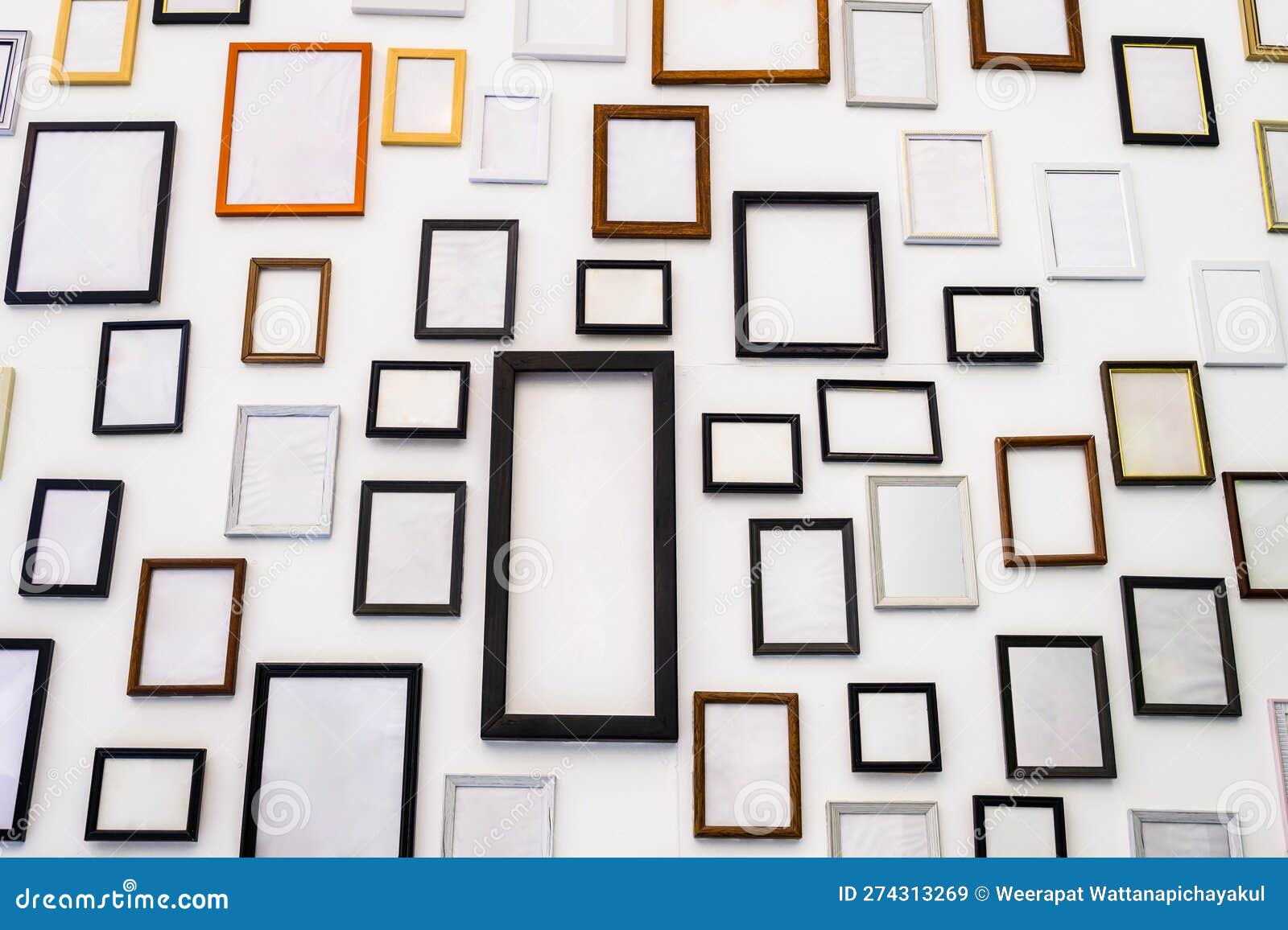 Photo frames on white wall stock image. Image of wooden 274313269