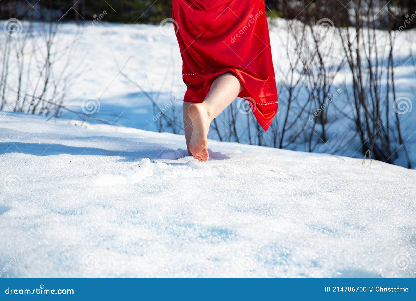 https://thumbs.dreamstime.com/z/photo-girl-red-dress-snow-spring-sunny-day-photo-barefoot-woman-red-dress-walking-snow-214706700.jpg?ct=jpeg