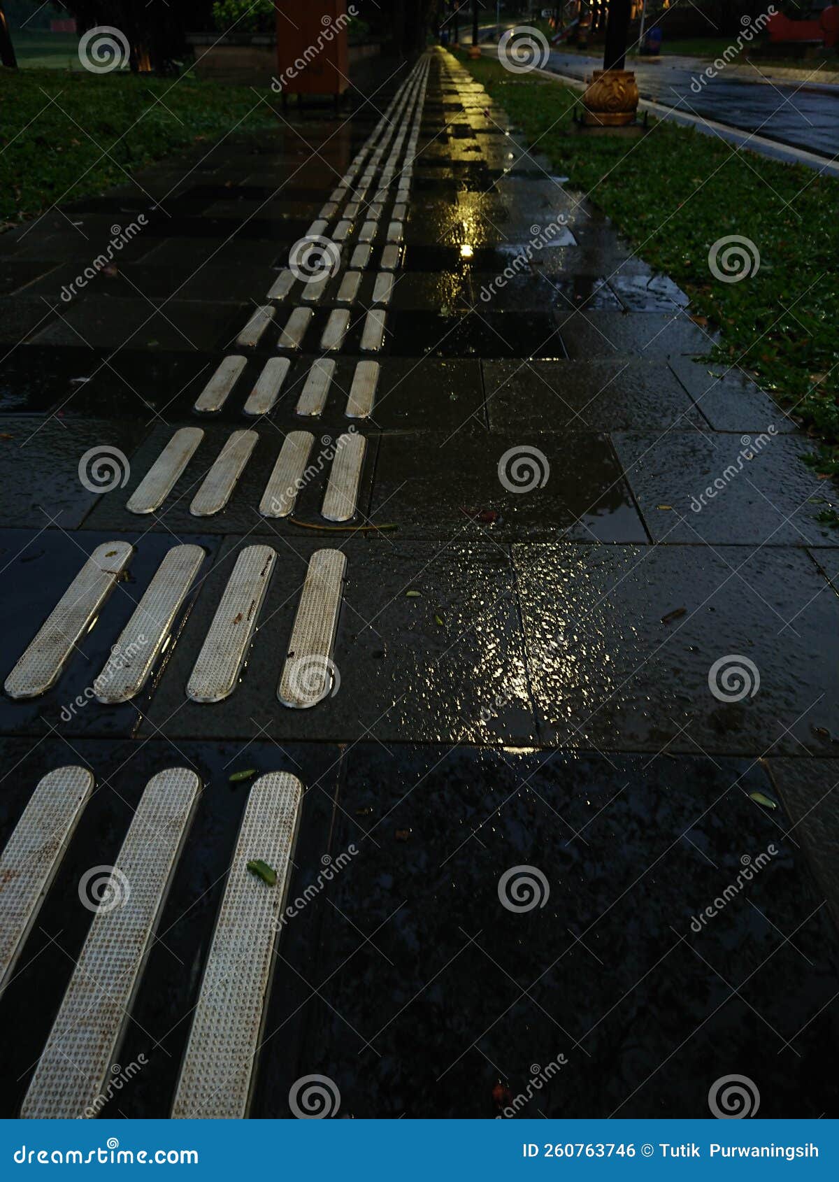 guidance blind at foot path in the evening after rain
