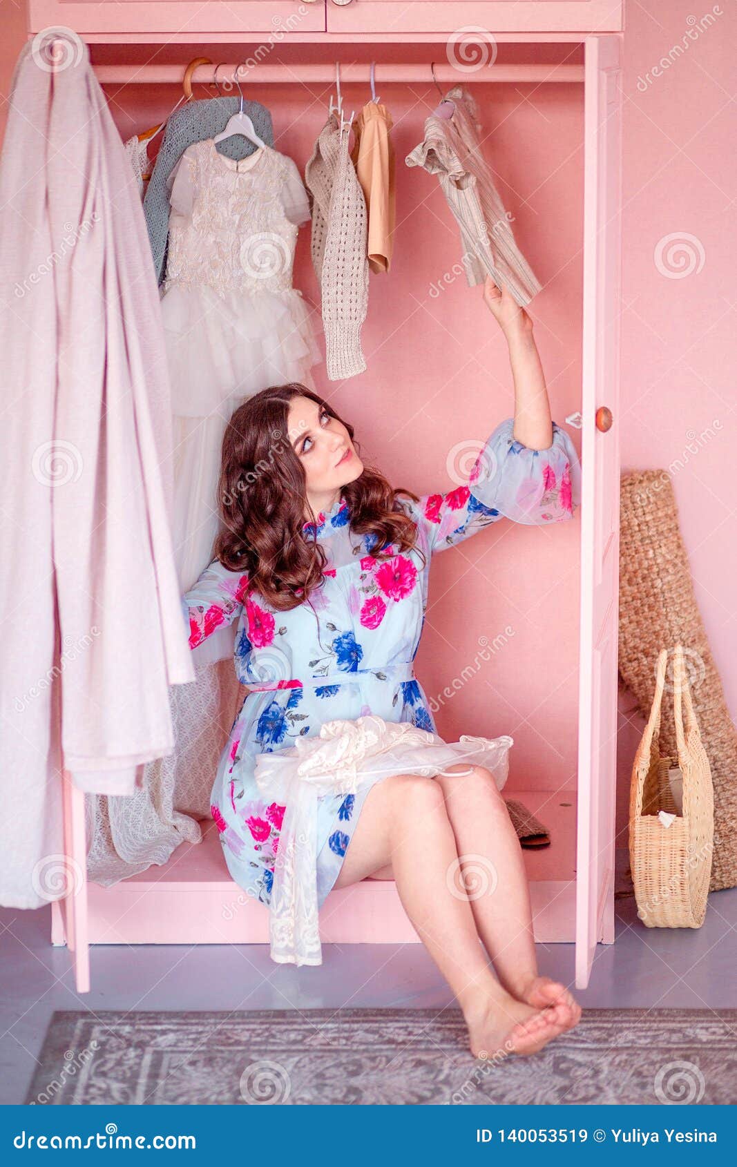 Happy Woman Sitting Inside The Wardrobe Vertical Photo Stock Image