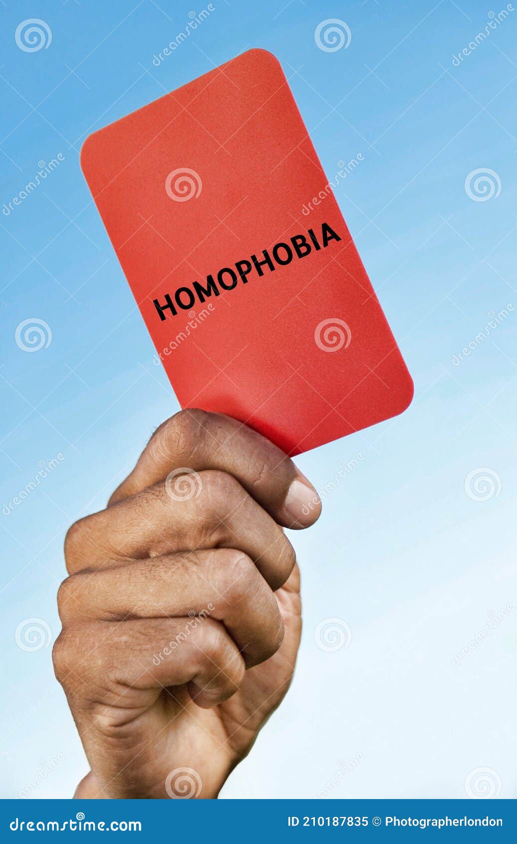 man holding out a homophobia red card