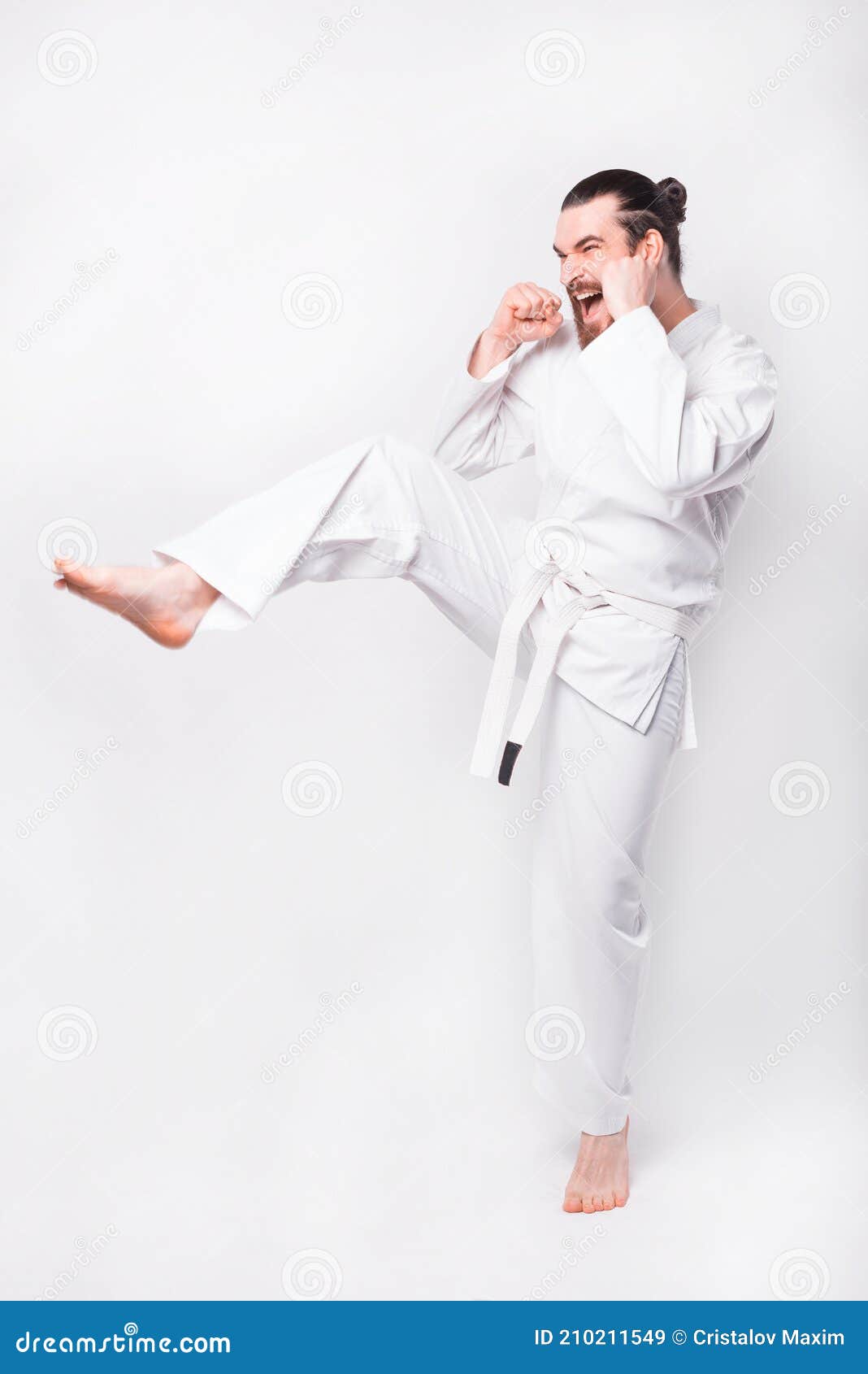 Photo of Man Practicing Taekwondo and Making a Kick with Leg Stock