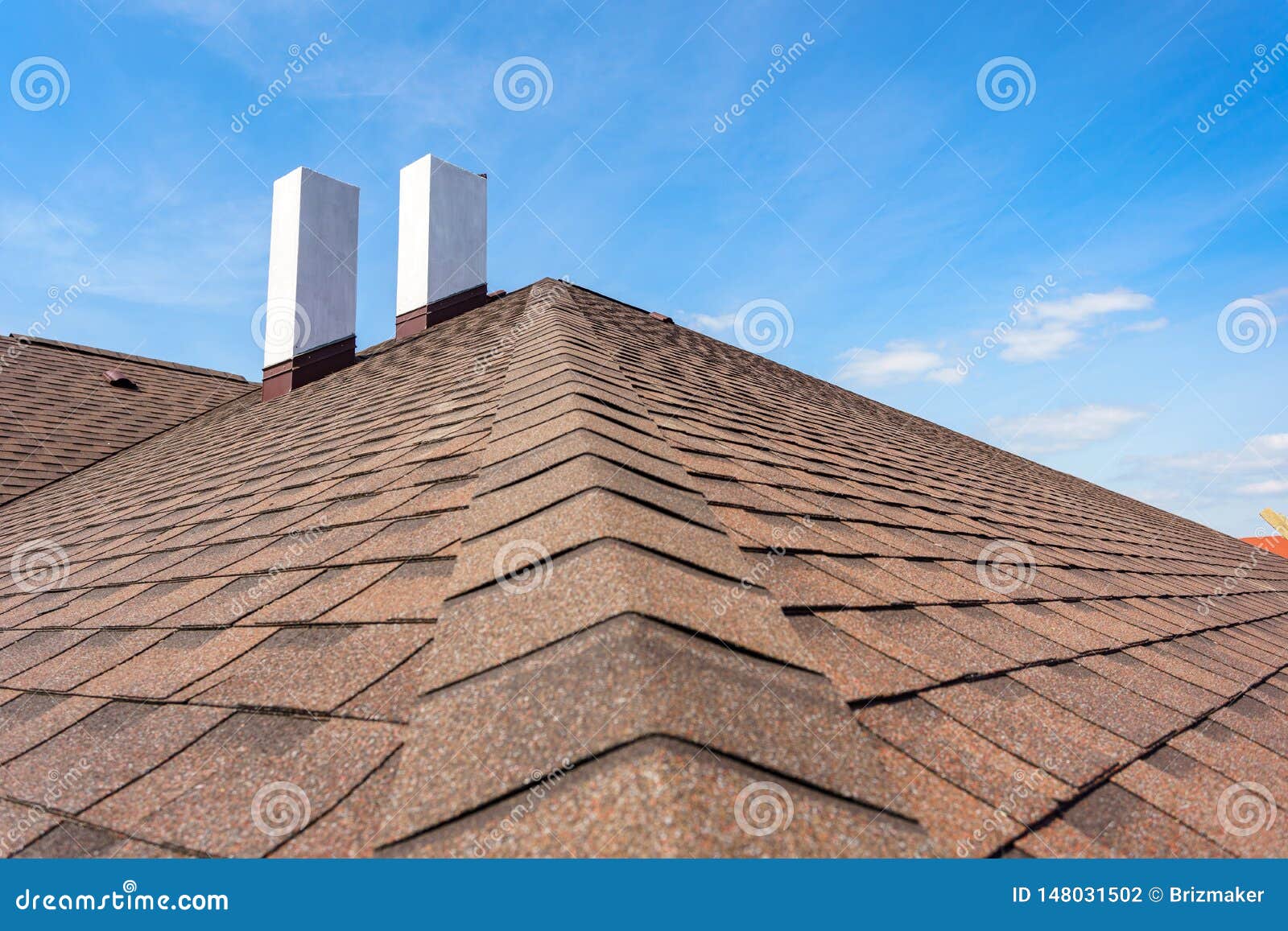Asphalt Tile Roof with Chimney on New Home Under Construction Stock