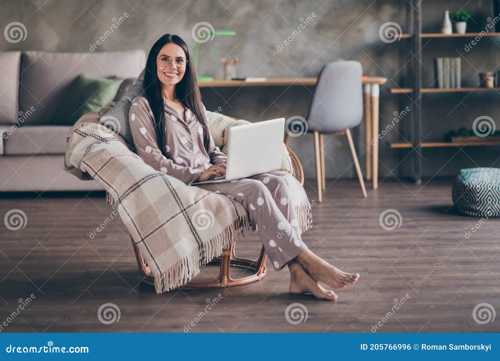 photo of nice optimistic girl sit type laptop wear pijama spectacles at home