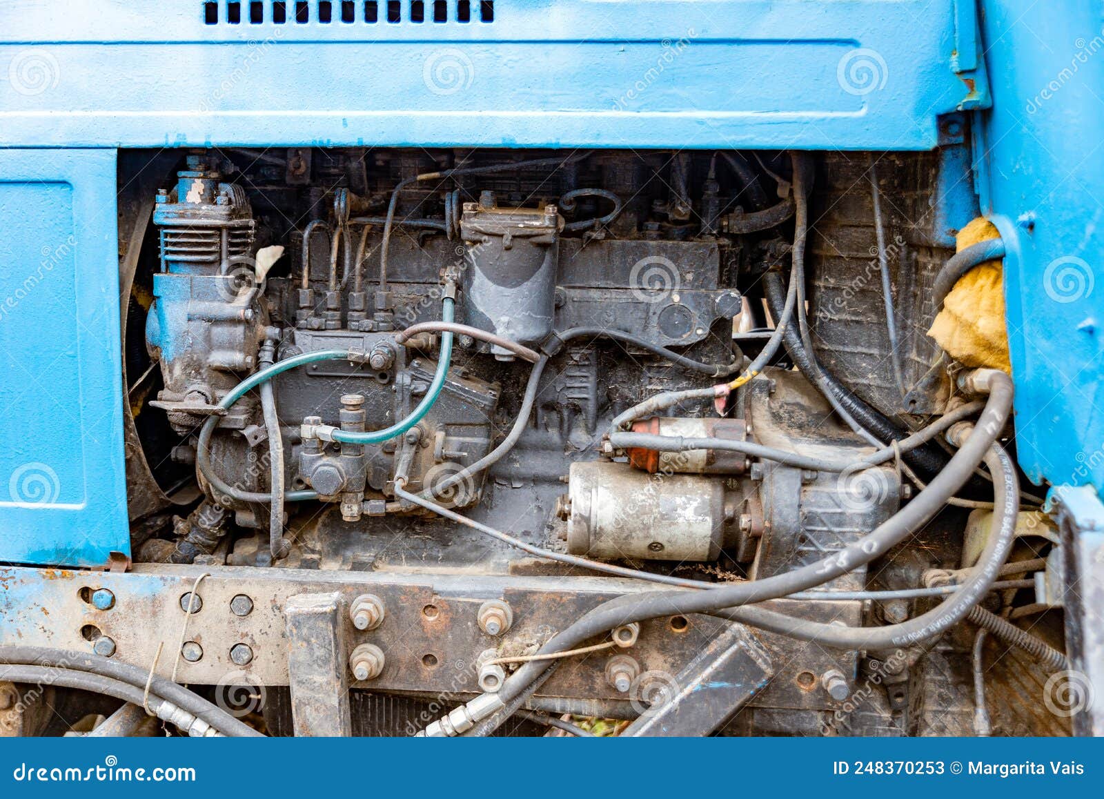 The Engine of an Old Soviet Tractor Photographed from the Side Stock