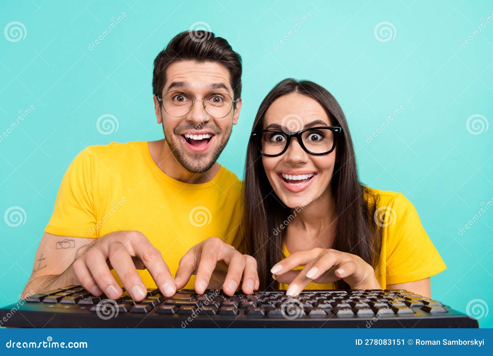 Photo of Overjoyed Funny Excited Nerd Geeks Writing Keyboard Looking ...