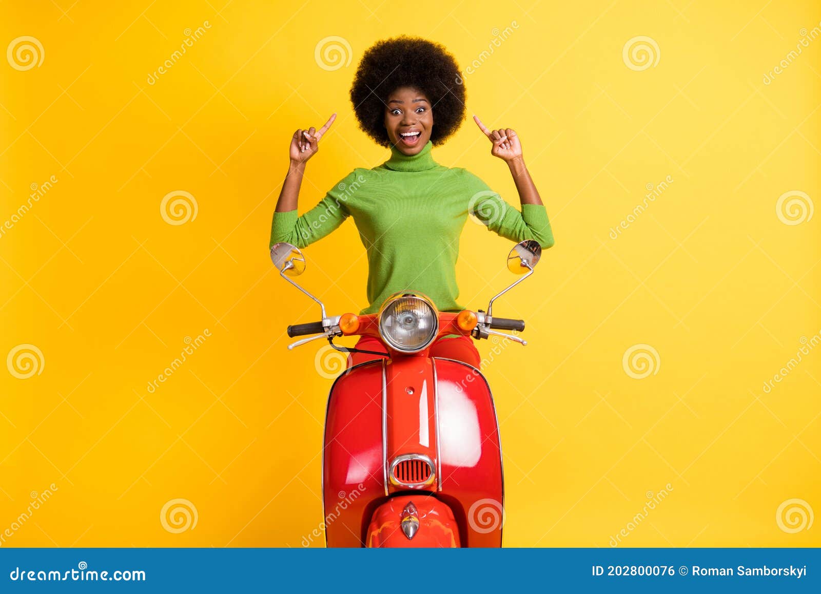 Photo Portrait of Young African American Woman Motorcyclist Pointing ...