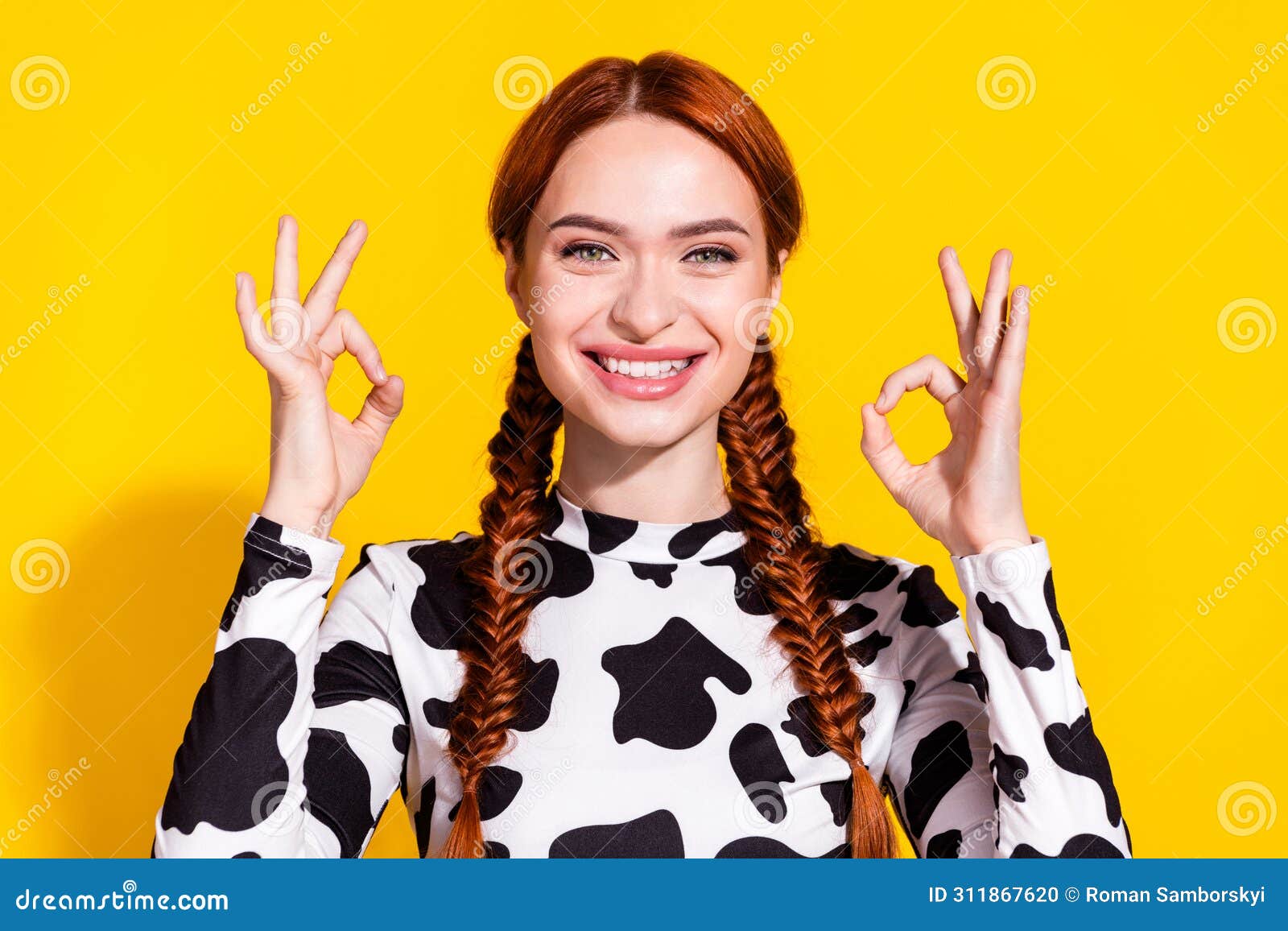 photo of positive charming lady dressed cowskin top showing two okey signs  yellow color background