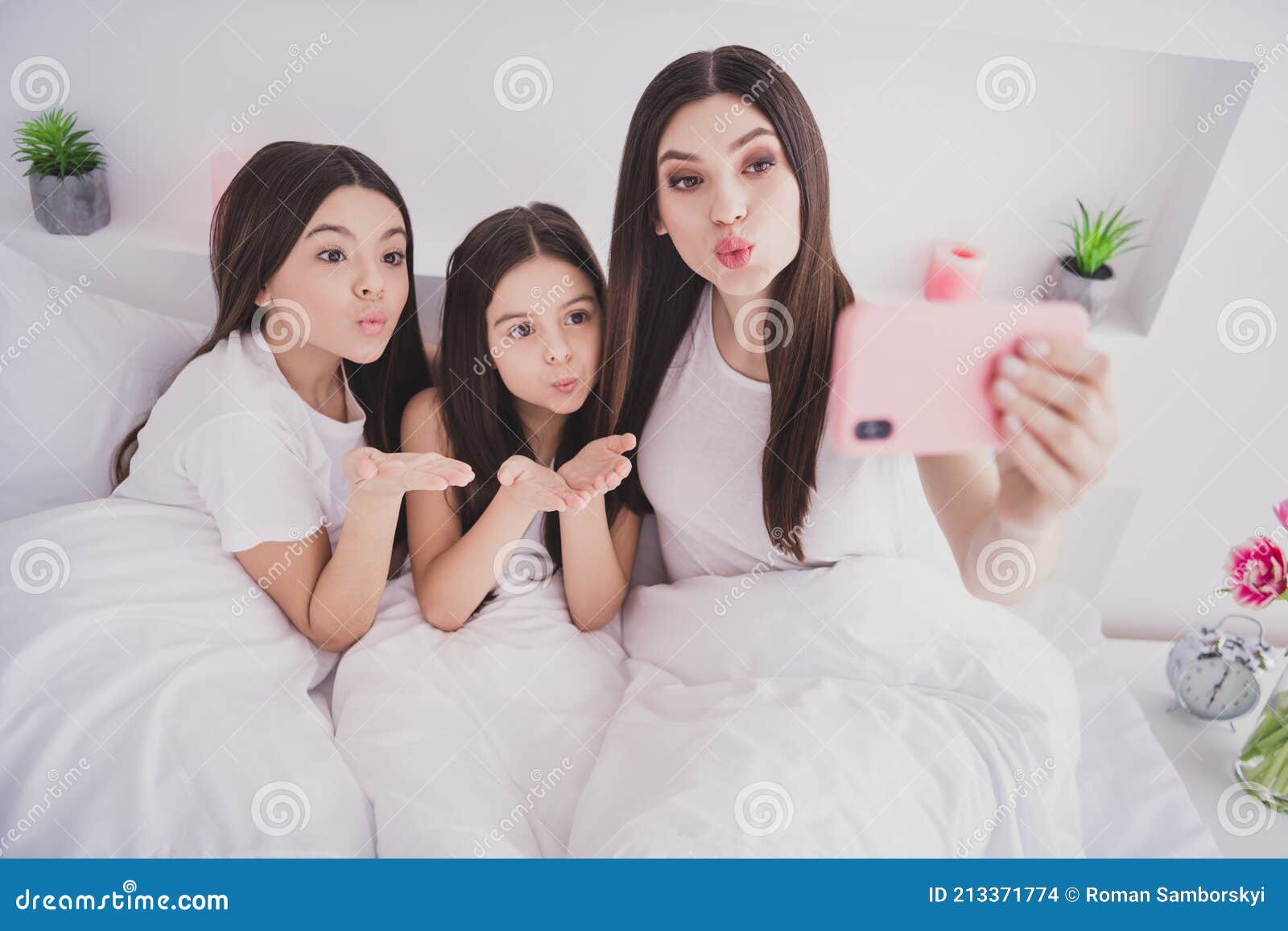 Photo of Pretty Cute Three Sisters Sleepwear Sitting Bed Having ...