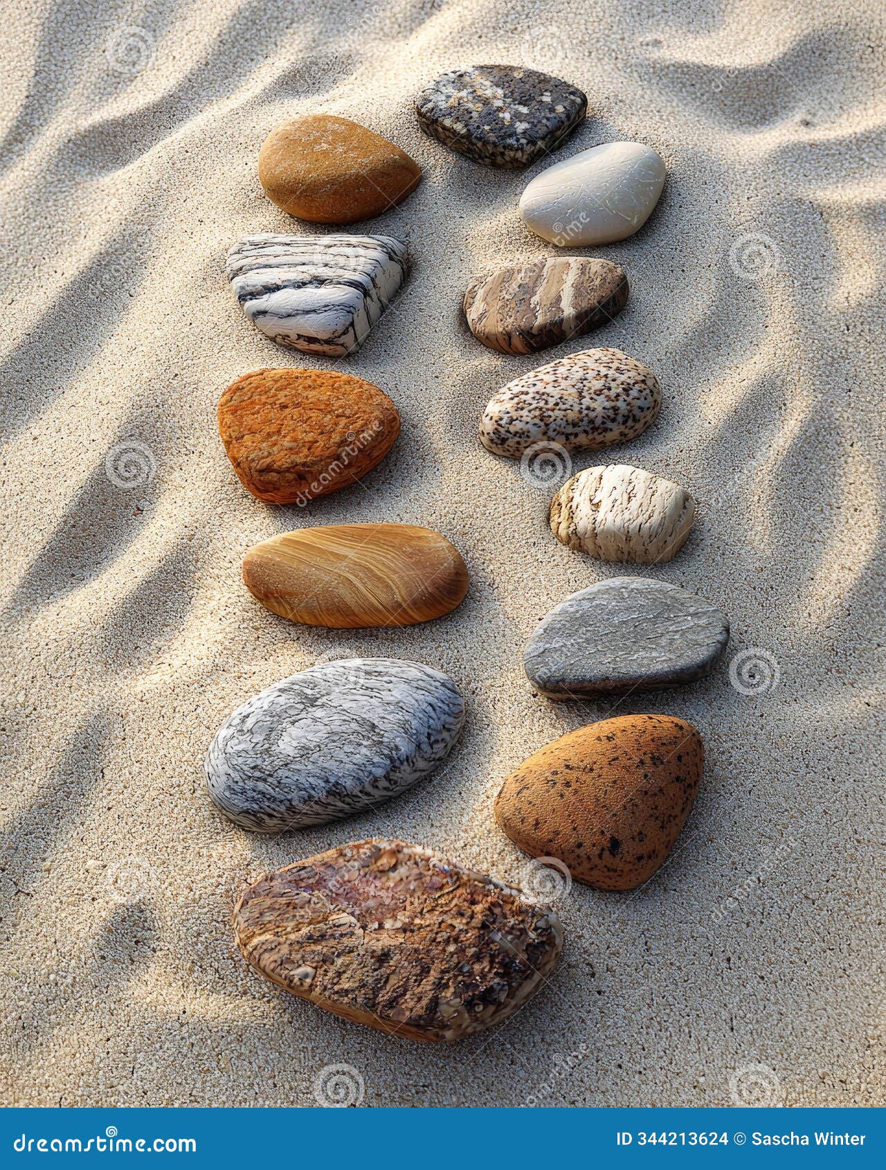 a photo-realistic image of an intricately arranged spiral pattern made from stones and pebbles on a sandy beach. generative ai