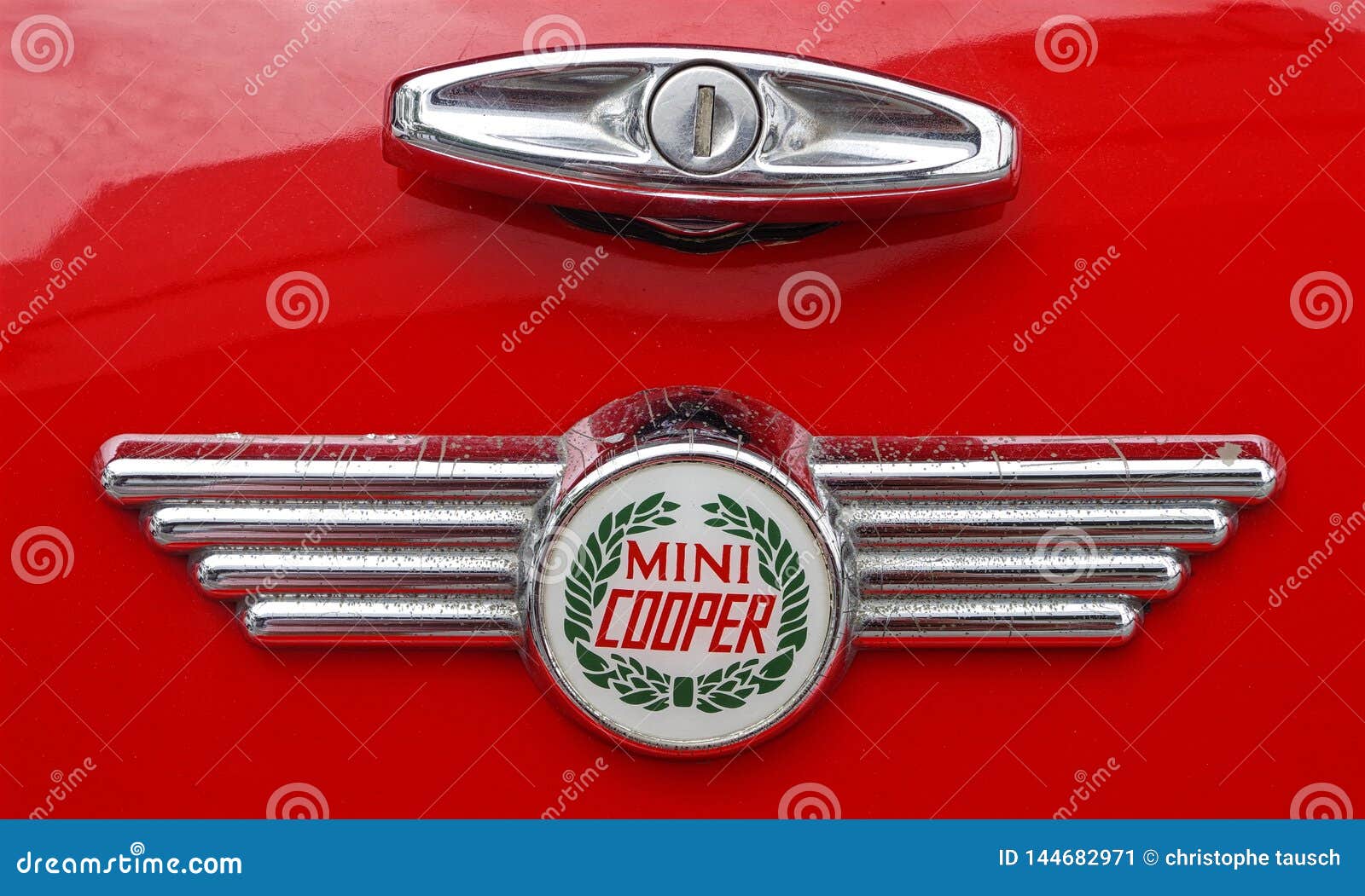 Photo of a Retro Mini Cooper Car Logo Badge on a Red Mini Cooper Car.  Editorial Photo - Image of chrome, motor: 144682971