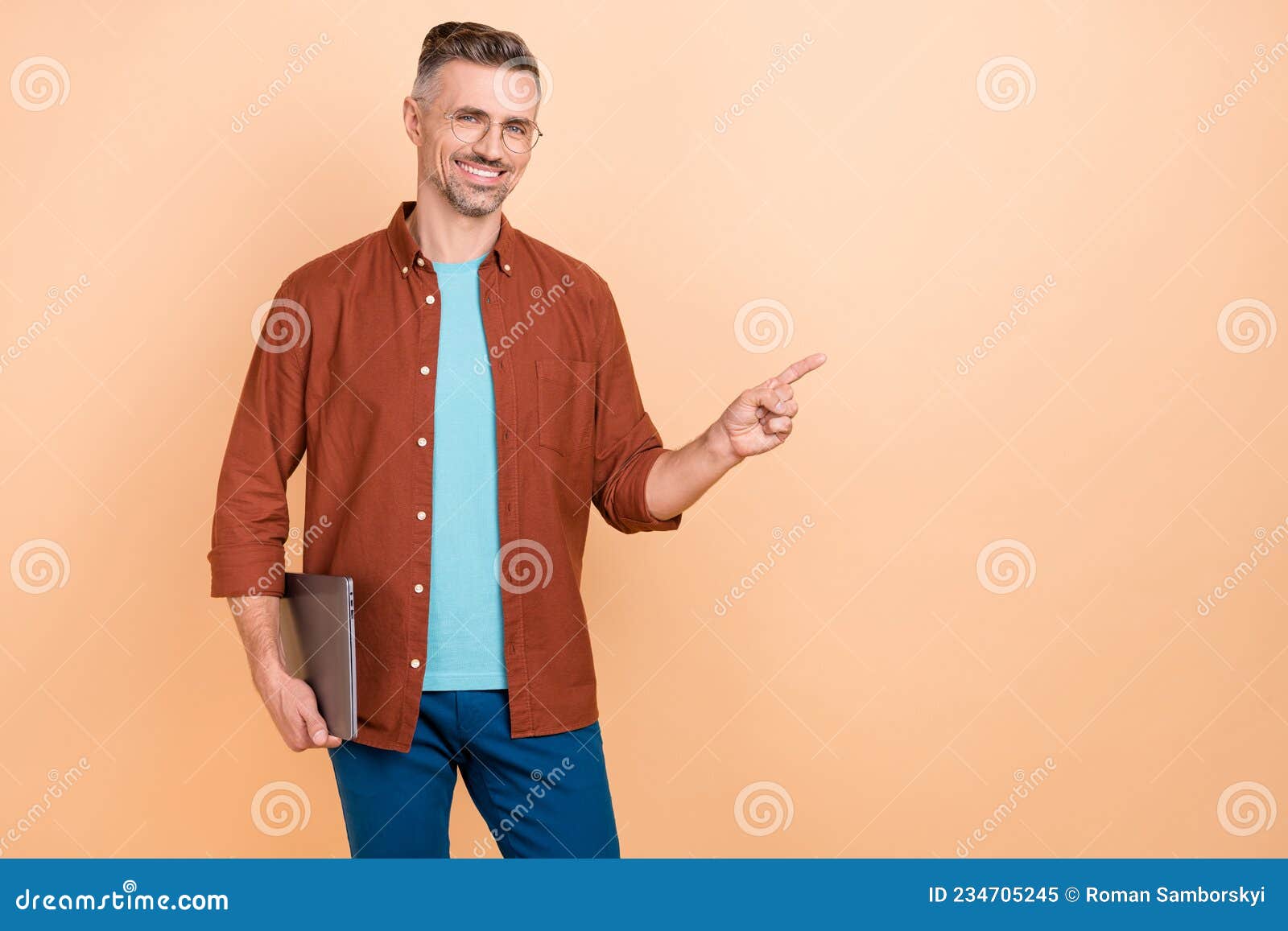 photo of smart middle-aged guy hold netbook point hand empty space marketing sale  over pastel color background