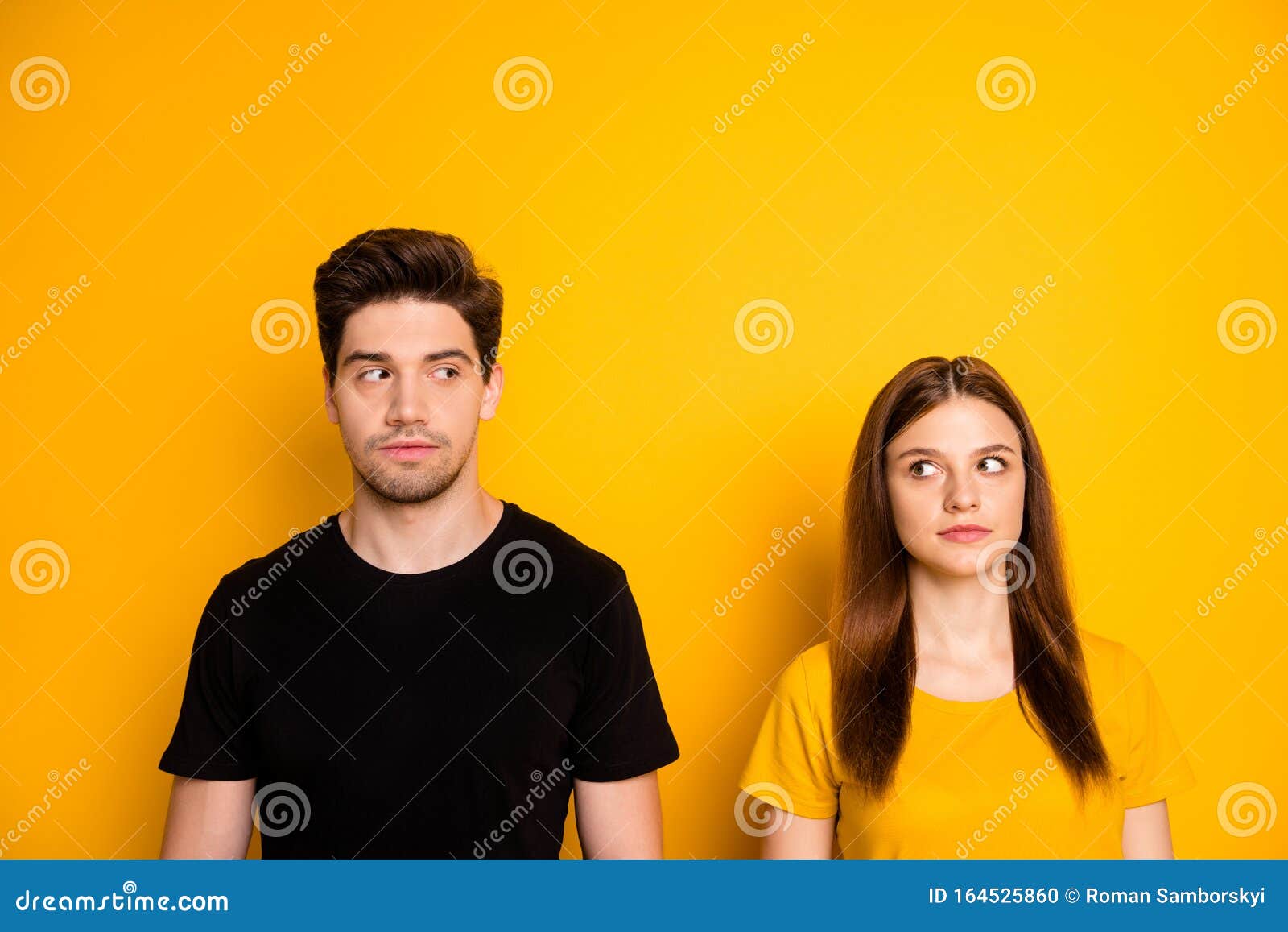 photo of suspicious thinking pondering couple uncertain about each other looking suspiciously suspecting  over