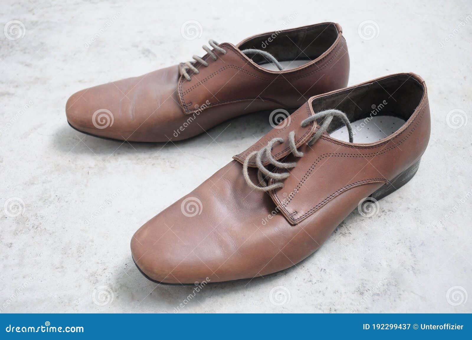 A Pair of Brown Men Business Shoe Laid Out on a Concrete Floor Stock ...