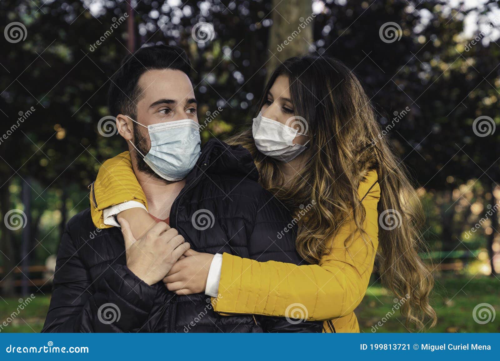 Photo of a Young and Attractive Couple on a Date in the Park Wearing a ...