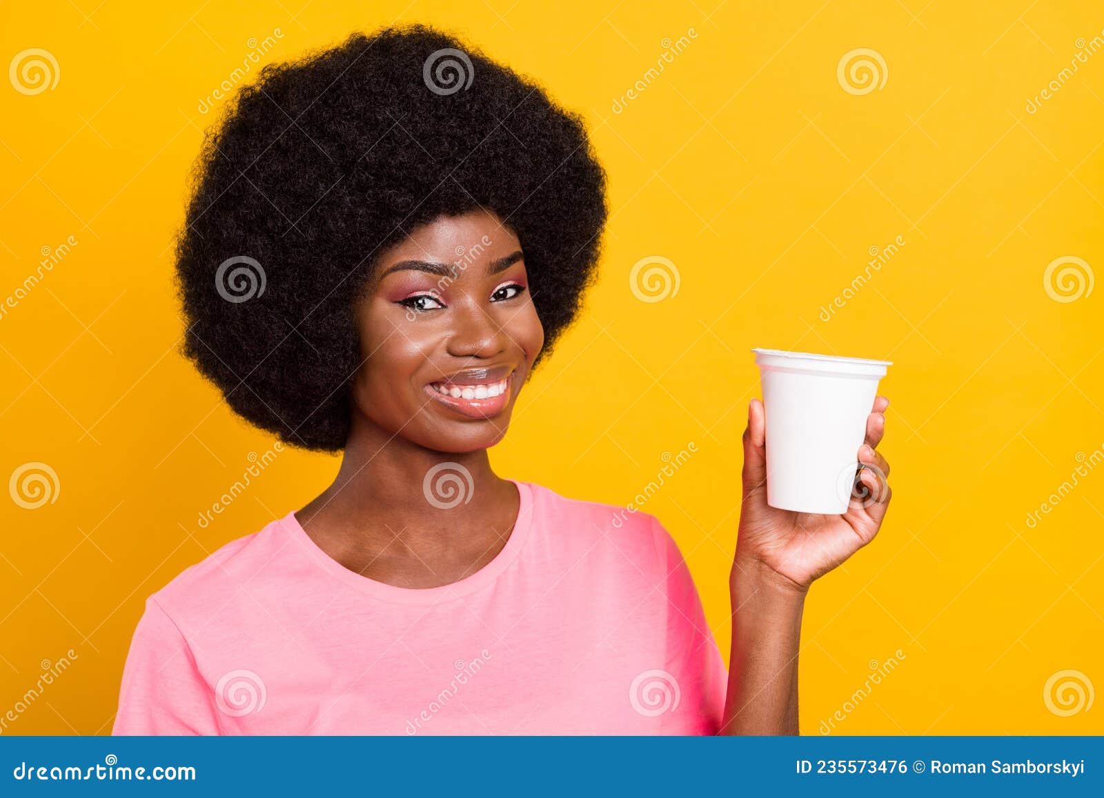 photo of young black girl happy positive smile show advise suggest pomo food product  over yellow color