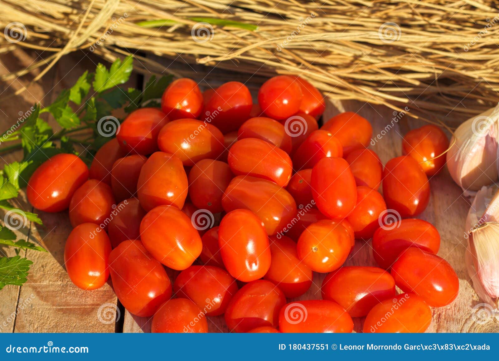 photograph of comer tomatoes on rustic background.