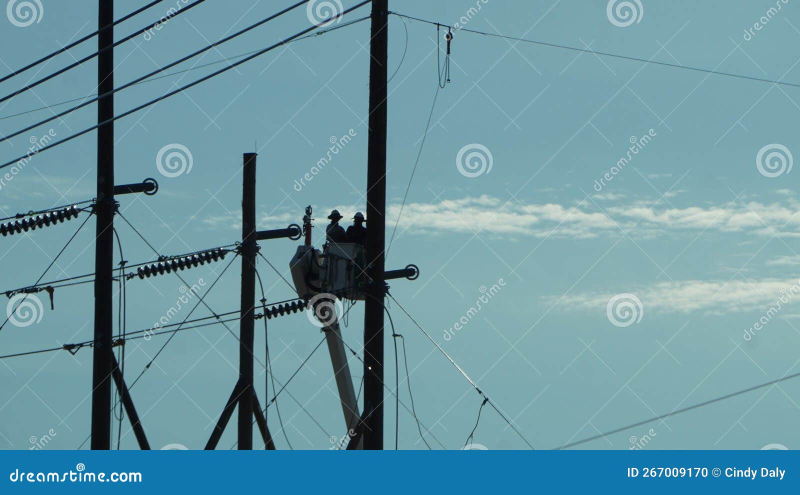 line men working on some power poles.