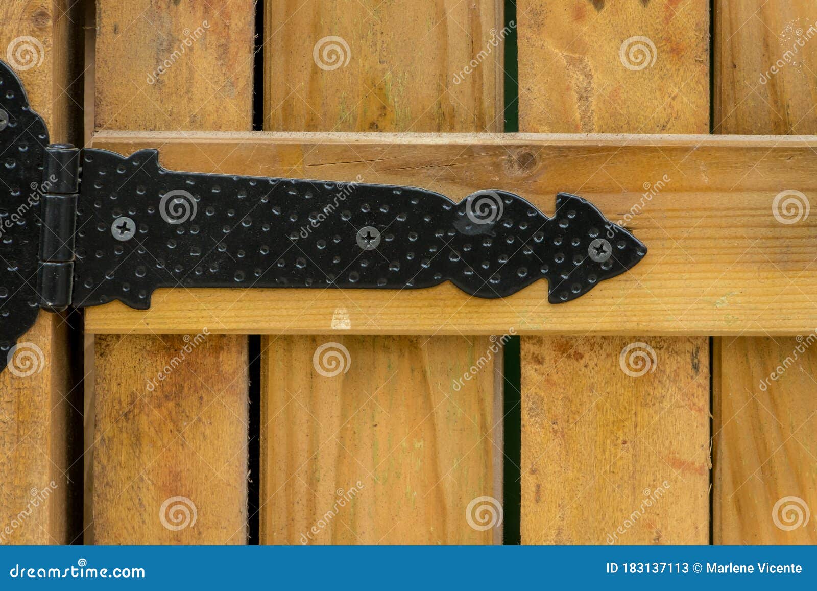 An Iron Hinge Of Closed Wooden Window Shutters RoyaltyFree Stock Photo