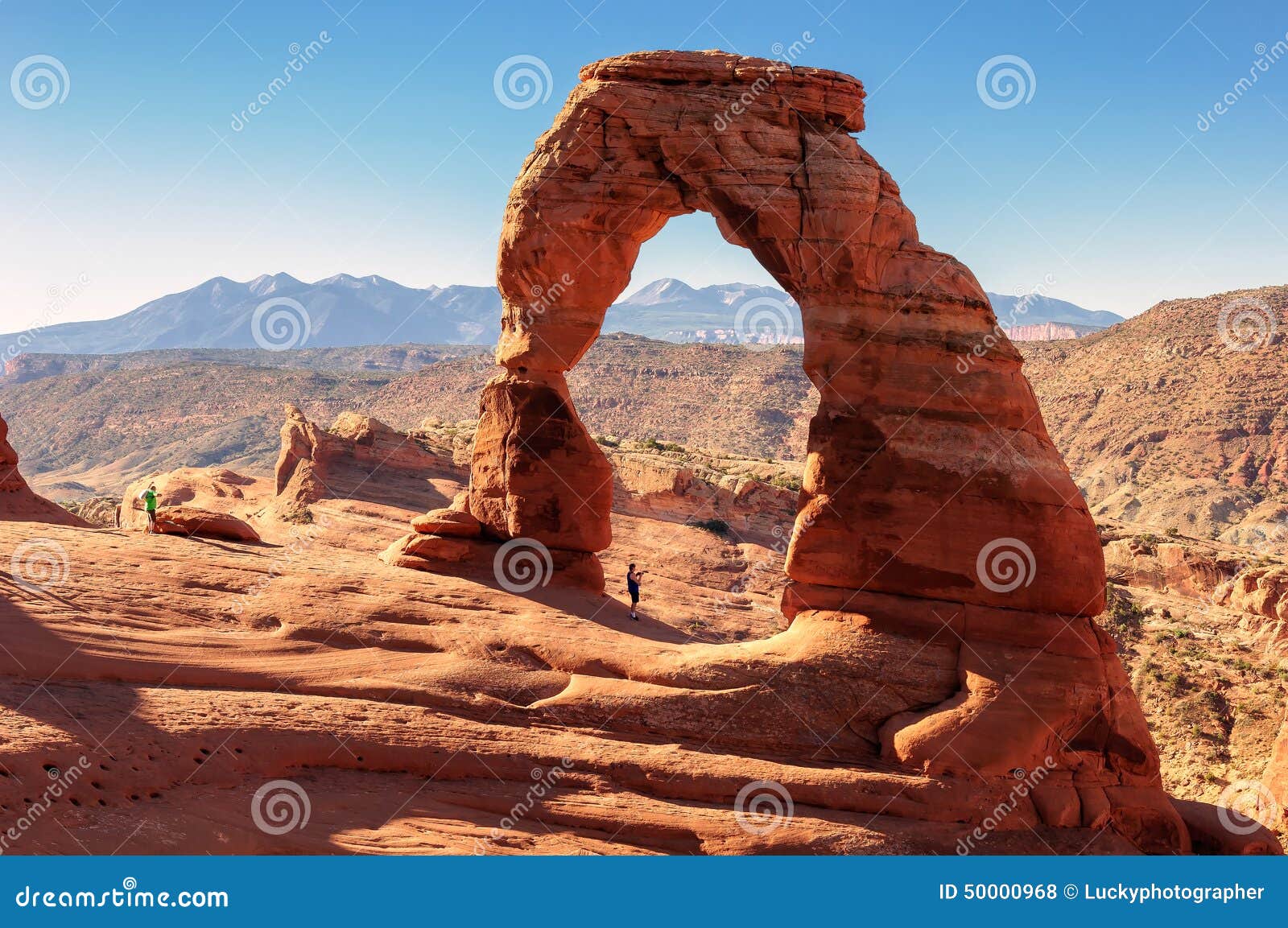 photographer at delicate arch, arches national park, utah