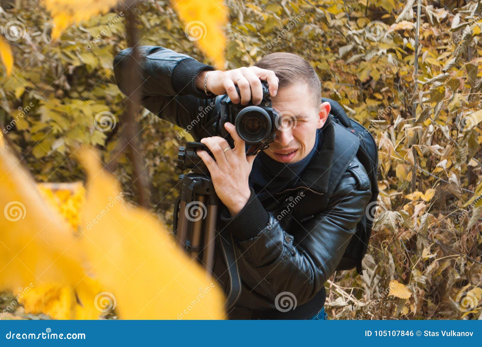 Photographer in a Leather Jacket Shoots in Autumn Park, Stock Photo ...