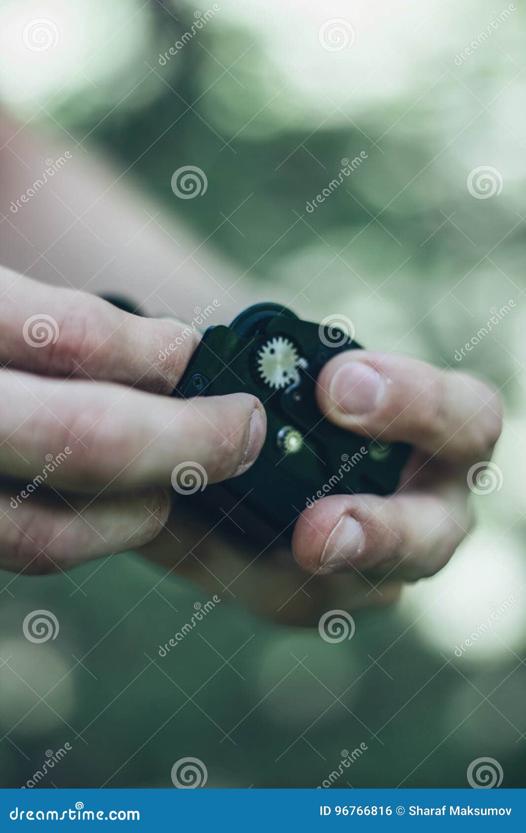 Photographer Loading Medium Format Film into the Film Back Stock Photo