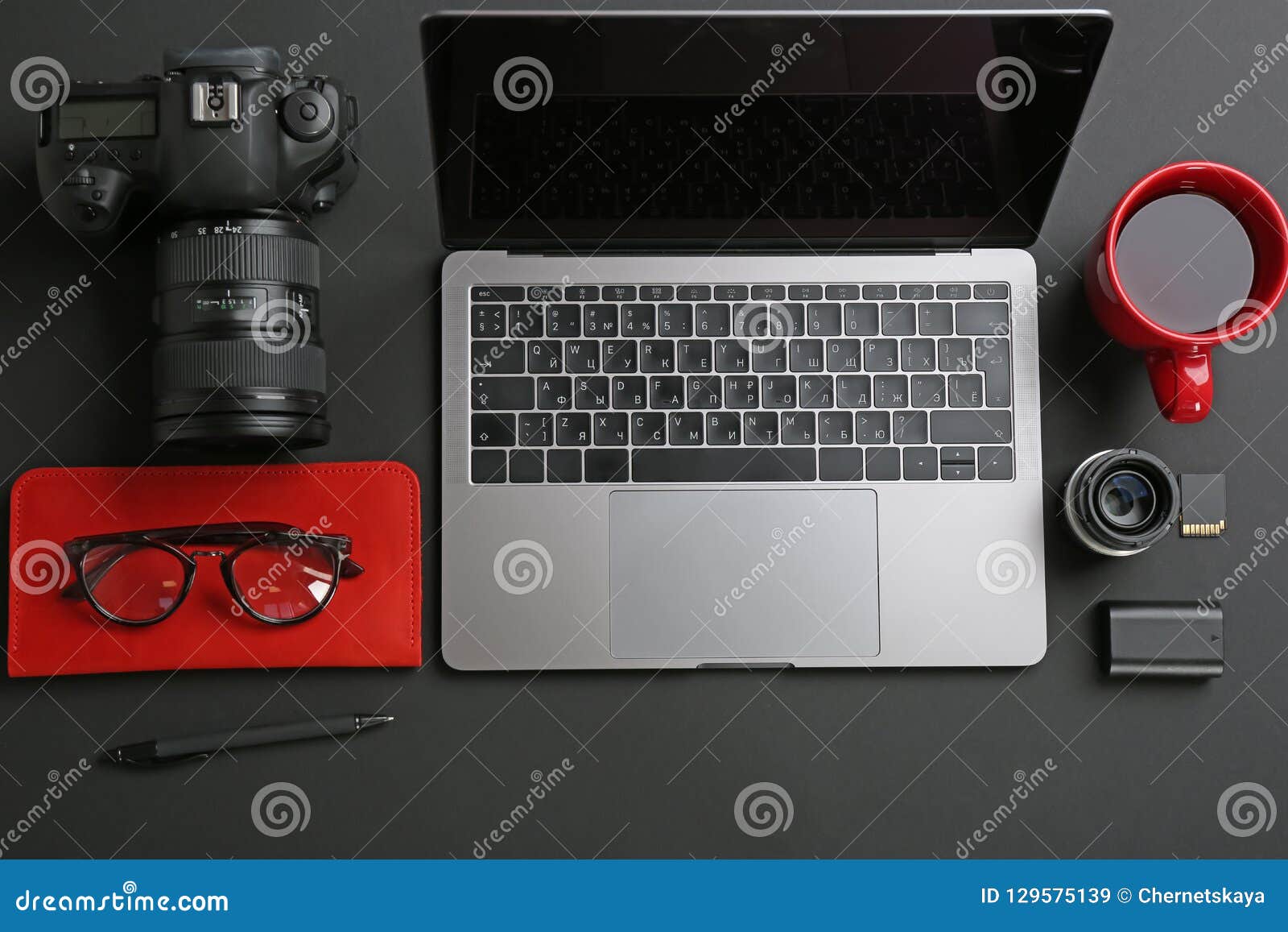 Photographer`s Workplace with Laptop and Camera on Table Stock Image