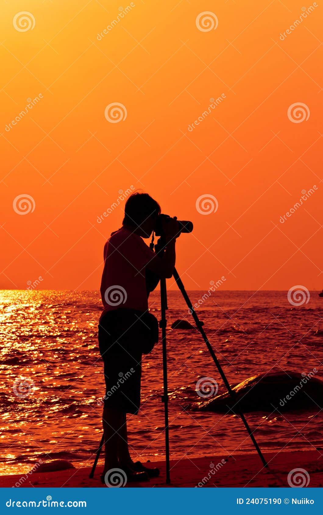 photographer with sillouette in hua hin beach