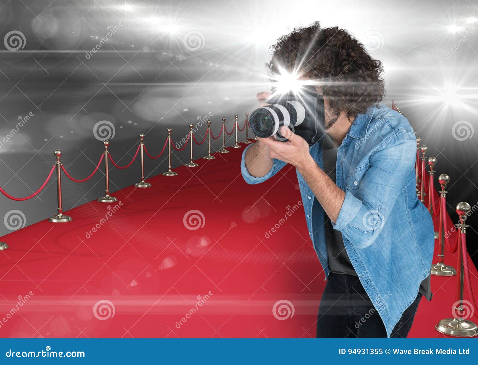 Photographer Taking a Photo with Flash in the Red Carpet. Flares ...