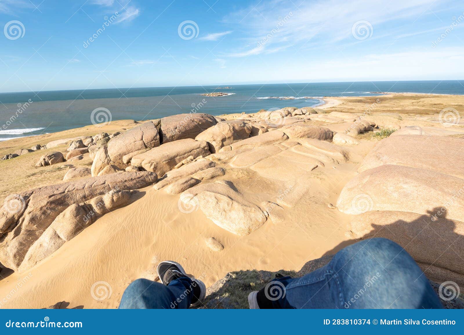 photographer walks through the dunes of the cabo polonia national park in the department of rocha in uruguay