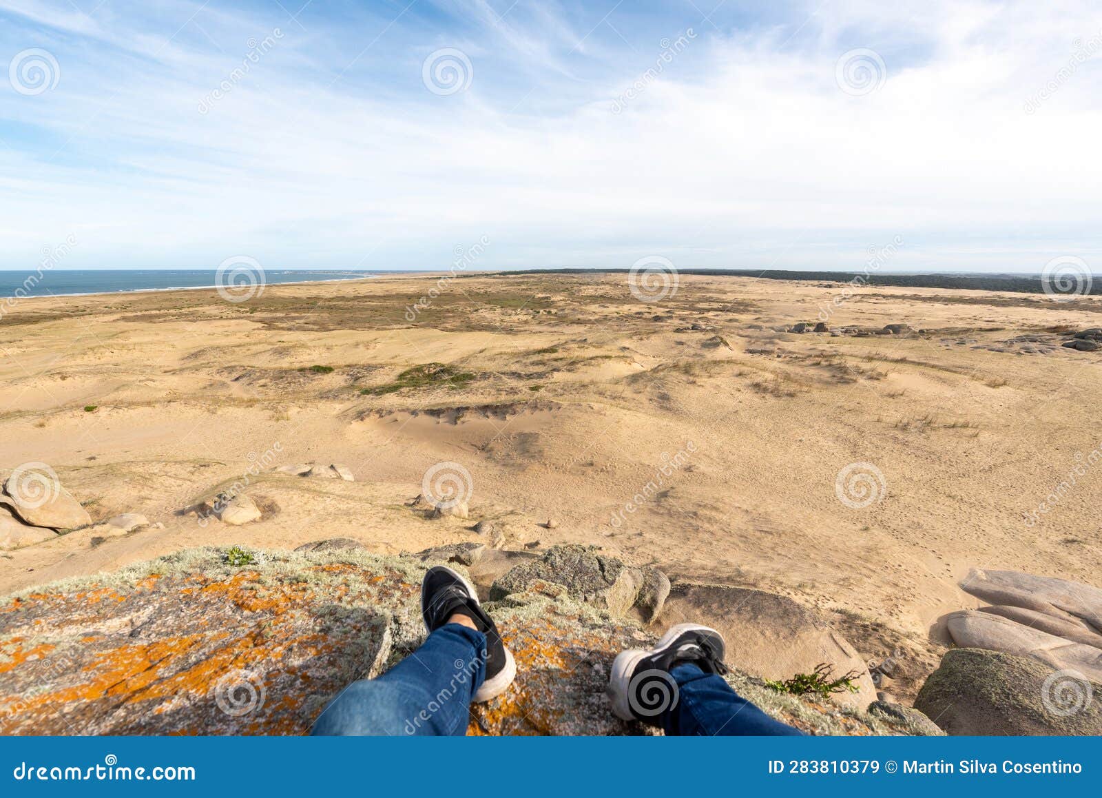 photographer walks through the dunes of the cabo polonia national park in the department of rocha in uruguay