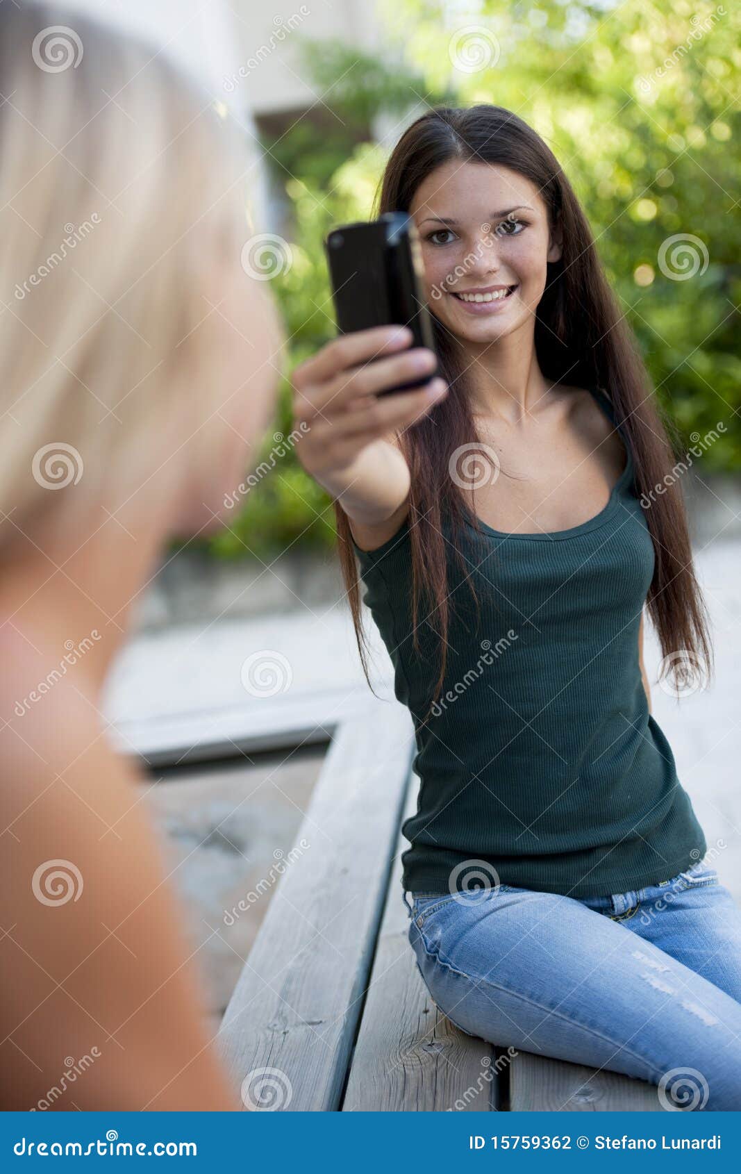 Photographing with Camera Phone Stock Photo Image of looking, people