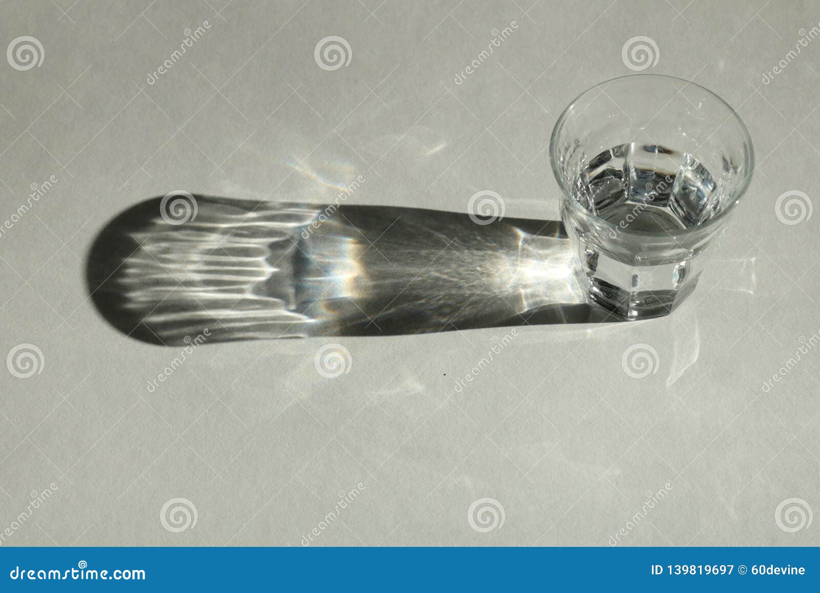 https://thumbs.dreamstime.com/z/photography-glass-filled-water-can-see-its-reflections-its-shadows-white-background-glass-water-139819697.jpg