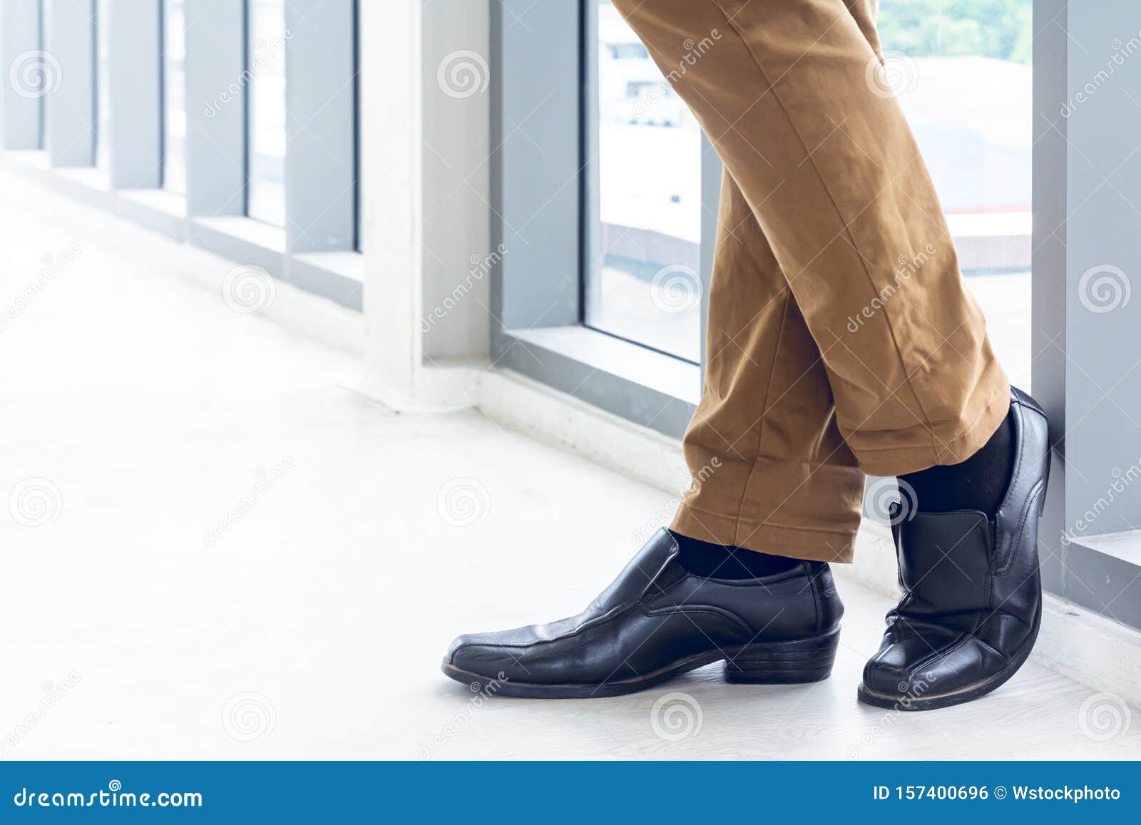 Person in Brown Pants and Black Shoes · Free Stock Photo