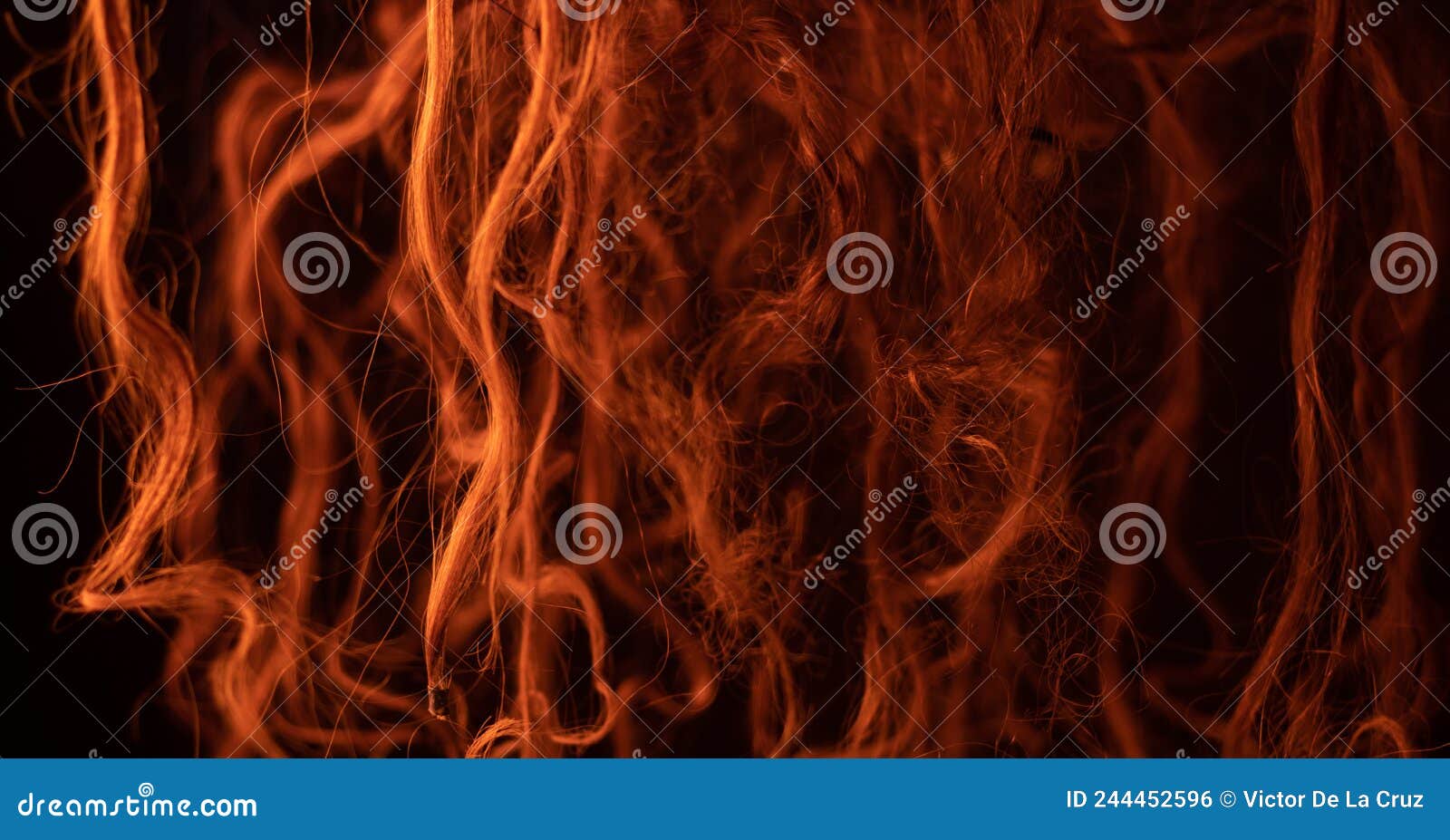 photoshoot abstract with hair in orange light like caos background