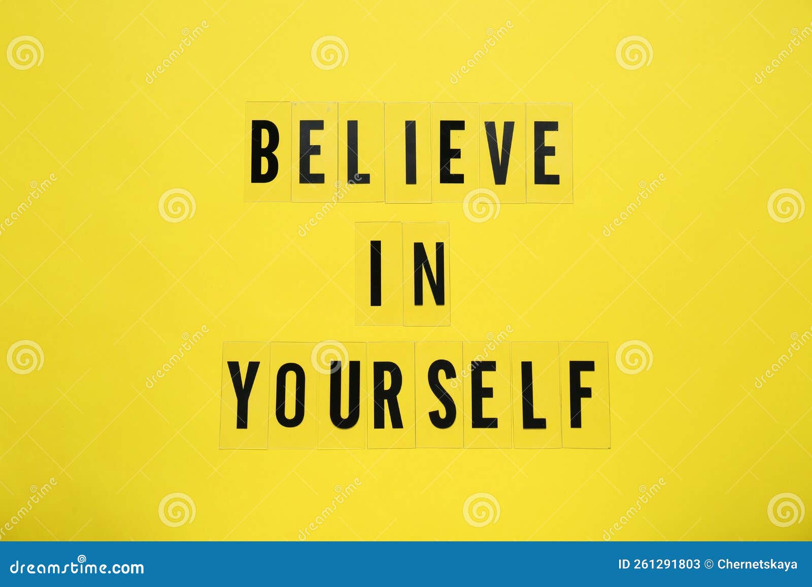 Phrase Believe In Yourself and hearts on yellow background, top view. Motivational quote