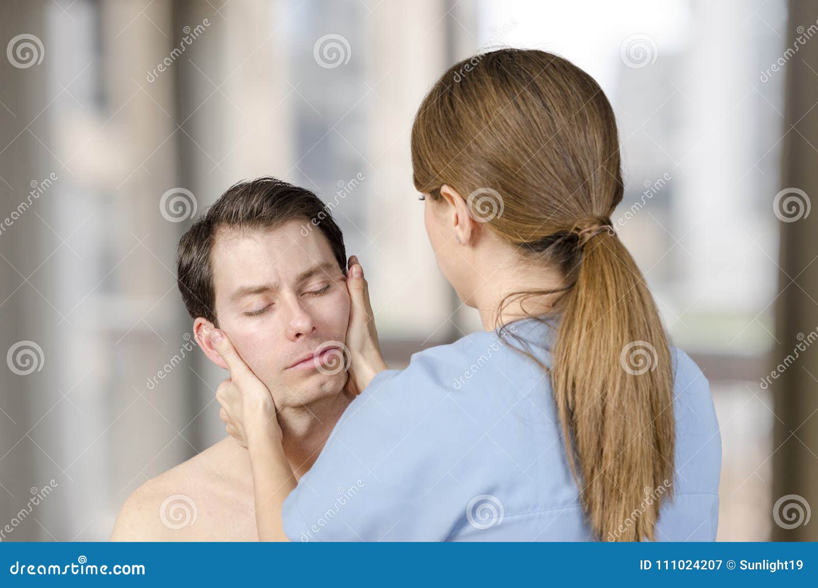 Physiotherapist, Chiropractor Doing Cervical Manipulation with R Stock