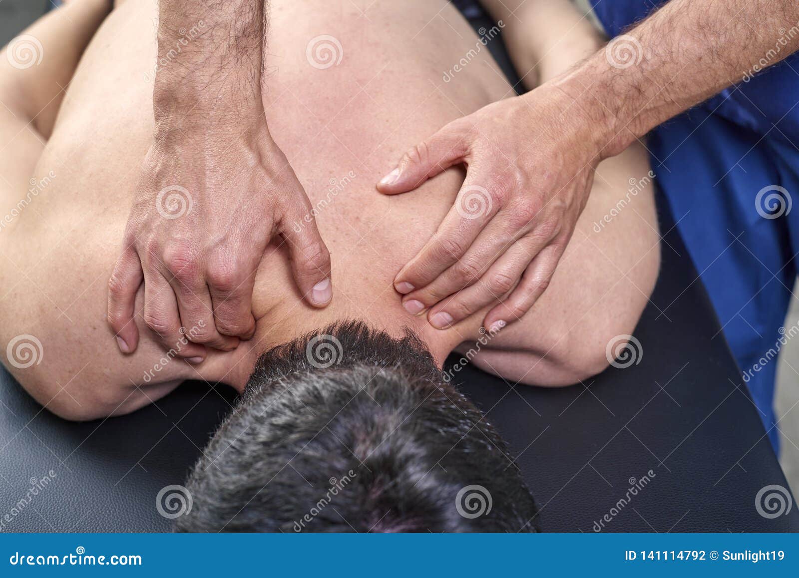 physiotherapist giving a back massage. chiropractic, osteopathy, manual therapy, acupressure