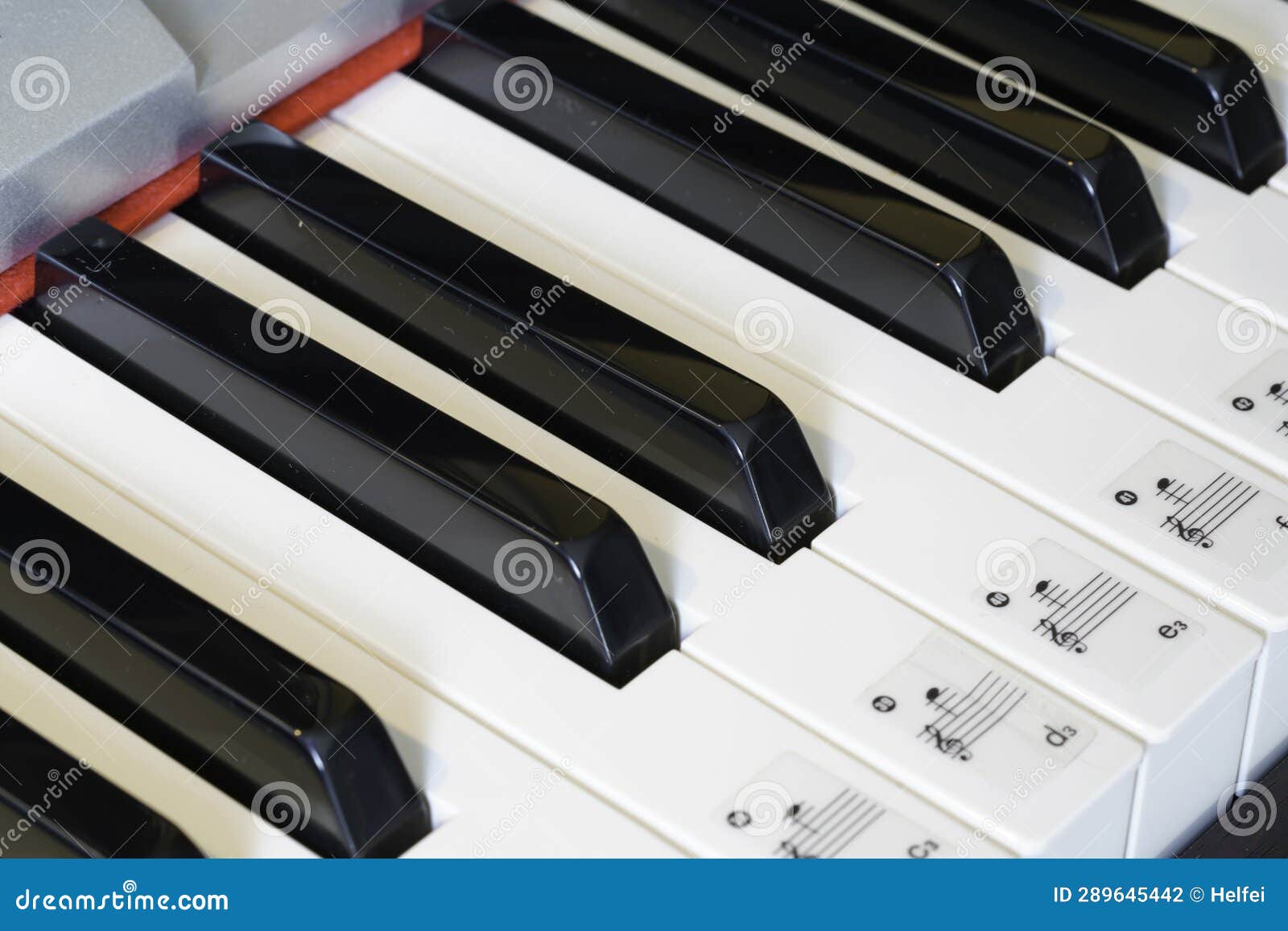 Piano with Black and White Keys in Detail with a Wooden Stock Photo
