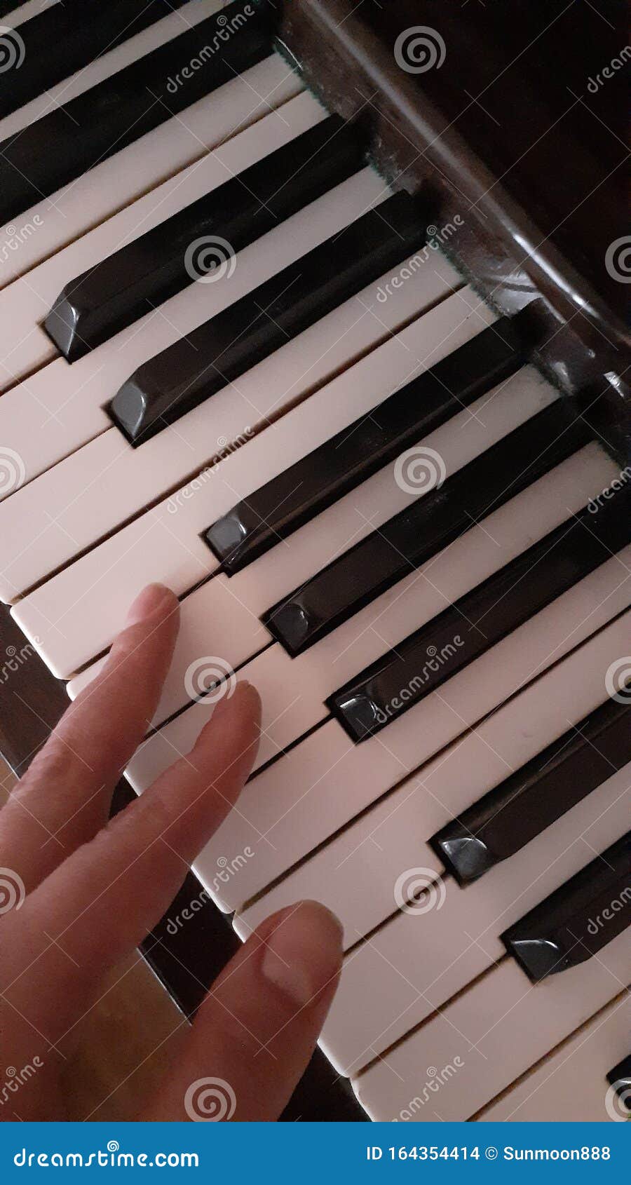 Piano keys and fingers stock photo. Image of piano, writing 164354414