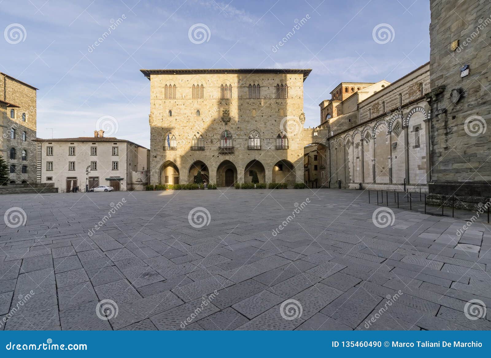 the piazza del duomo in pistoia and the palazzo del comune without people, tuscany, italy