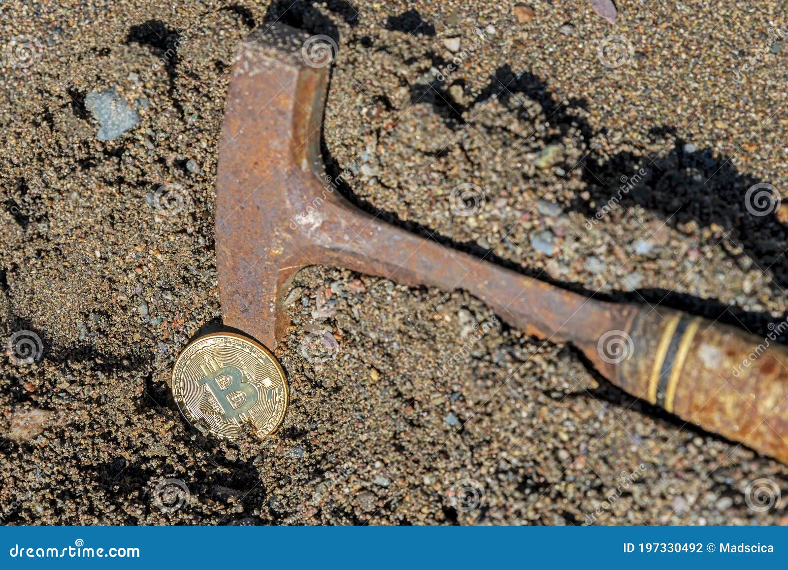 A Pick Axe Digging a Bitcoin Out of Sandy Ground Stock Photo - Image of  sand, bitcoin: 197330492