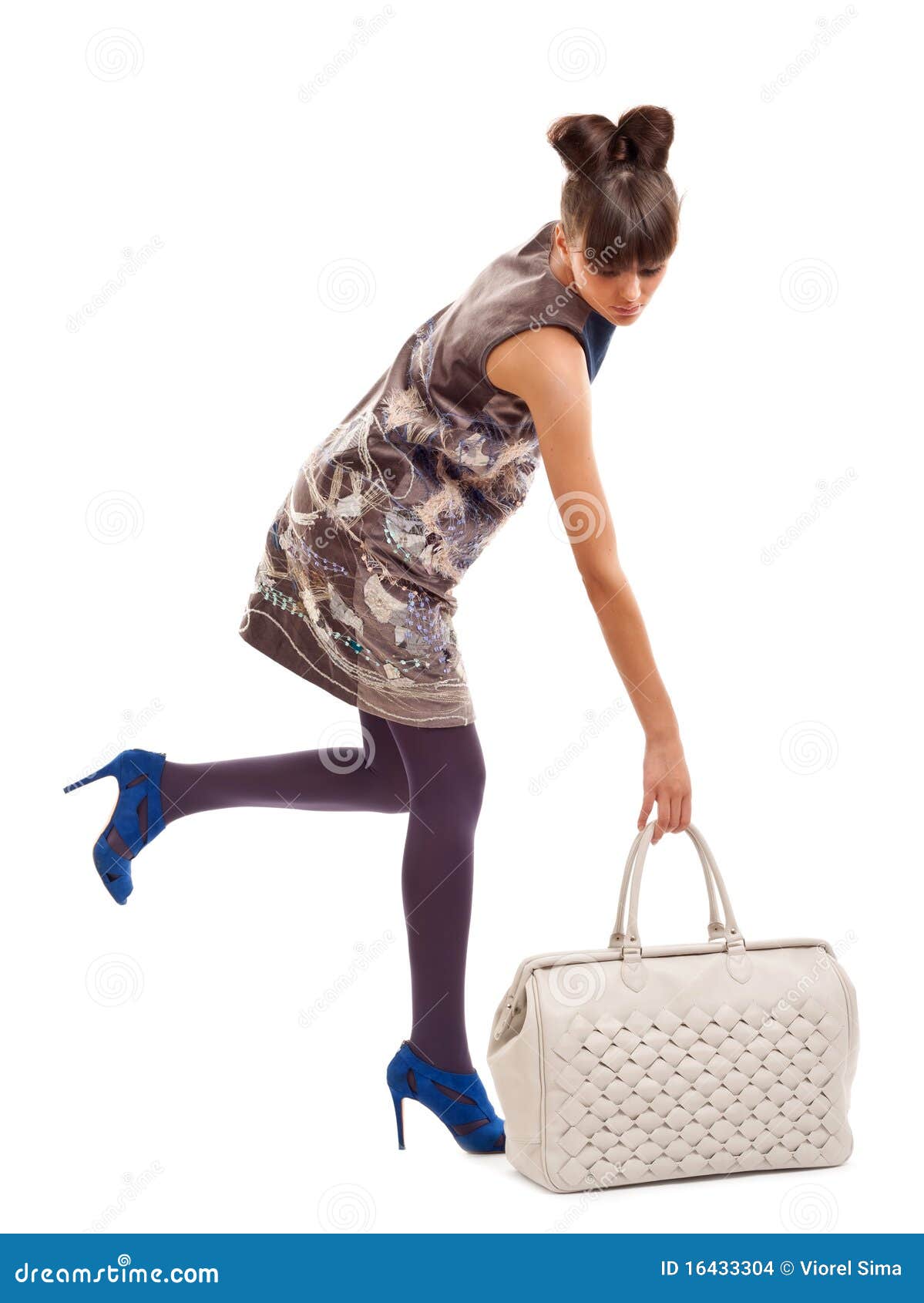 Picking up a big purse stock photo. Image of female, attractive 16433304