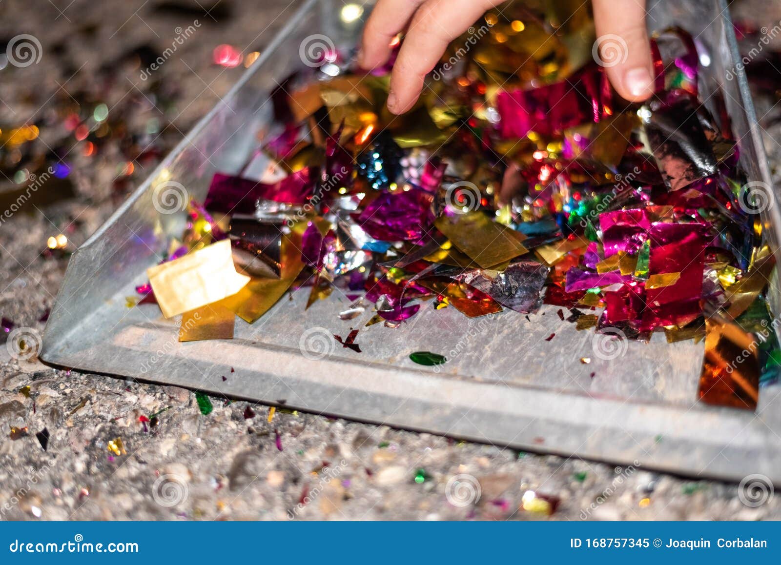 Picking Up and Cleaning the Confetti Remains of a Party Stock Image