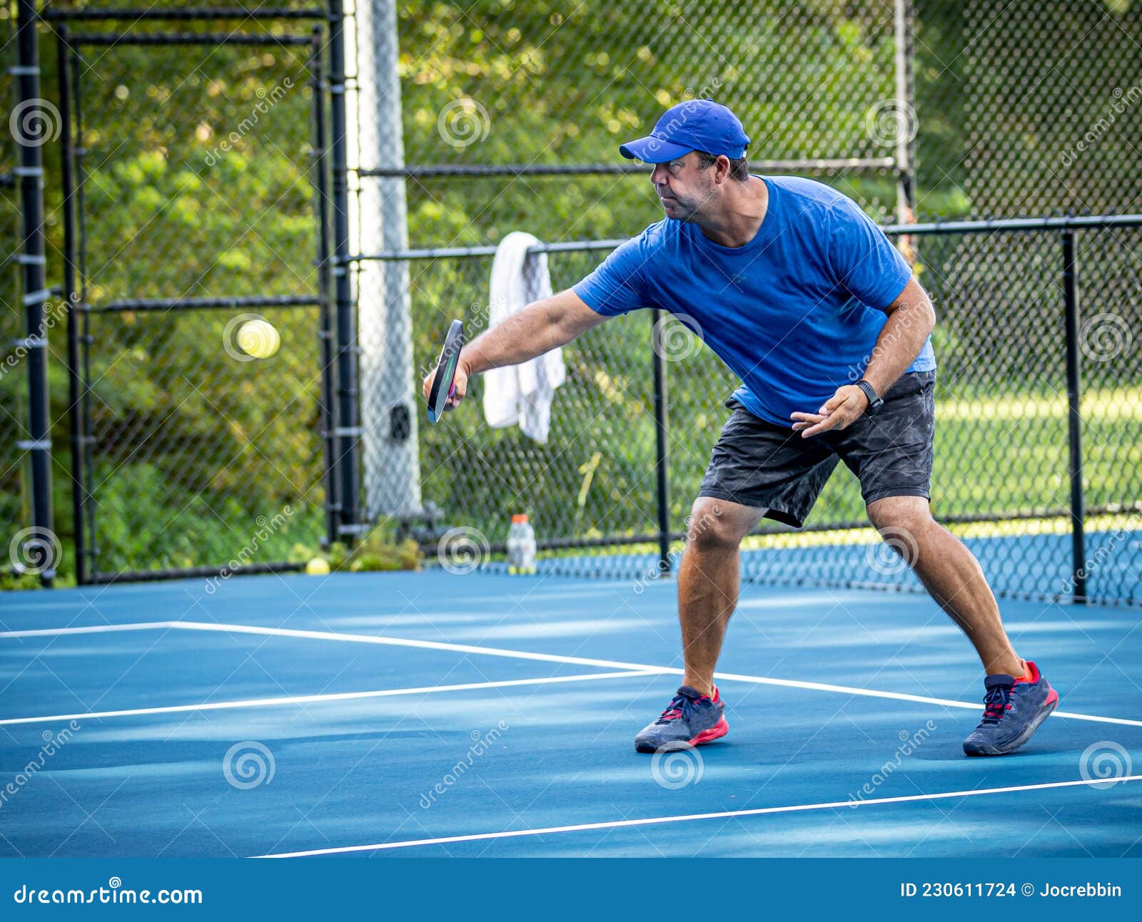 Pickleball Instructor Demonstrates the Backhand Volley.tif Stock Photo