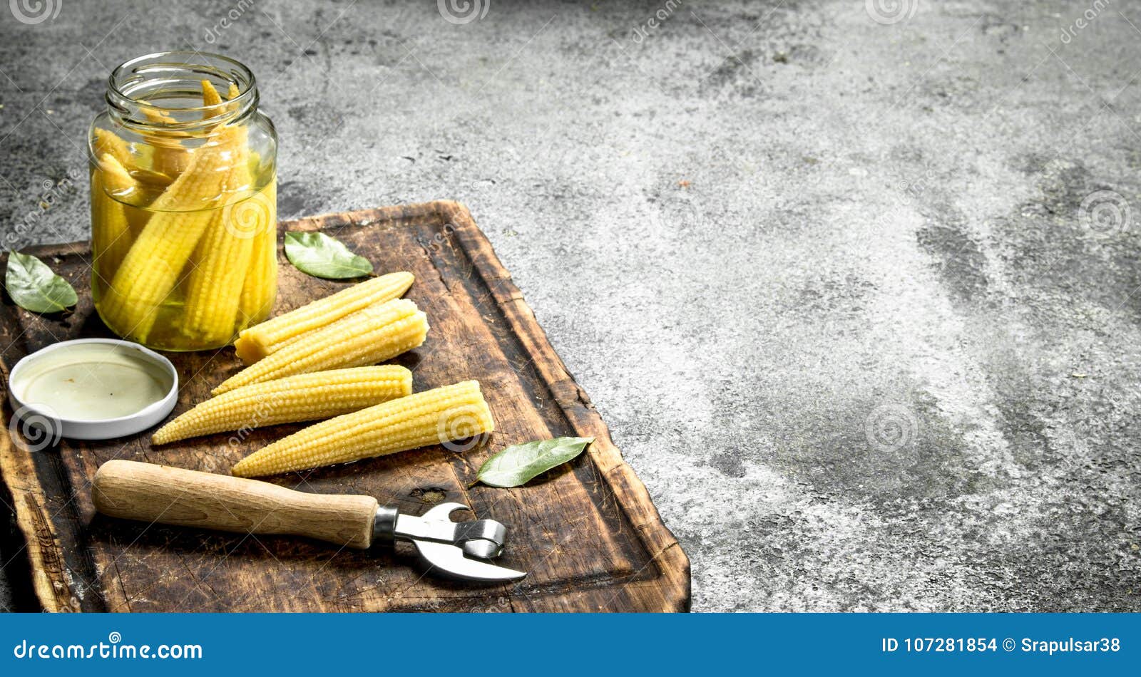 Pickled Corn in a Jar on a Cutting Board. Stock Photo Image of