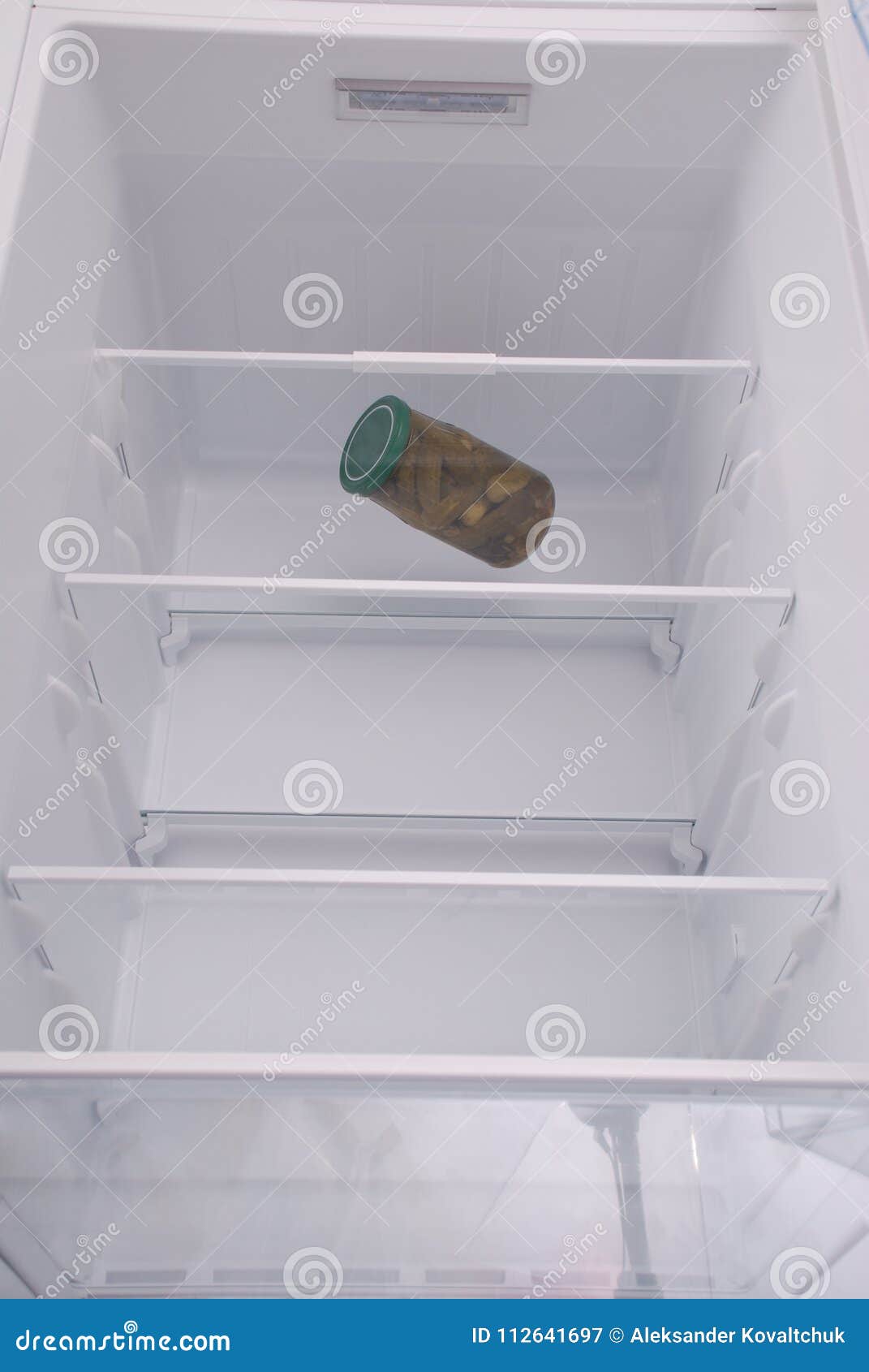 Pickled Cucumbers Inside in Empty Clean Refrigerator Stock Image