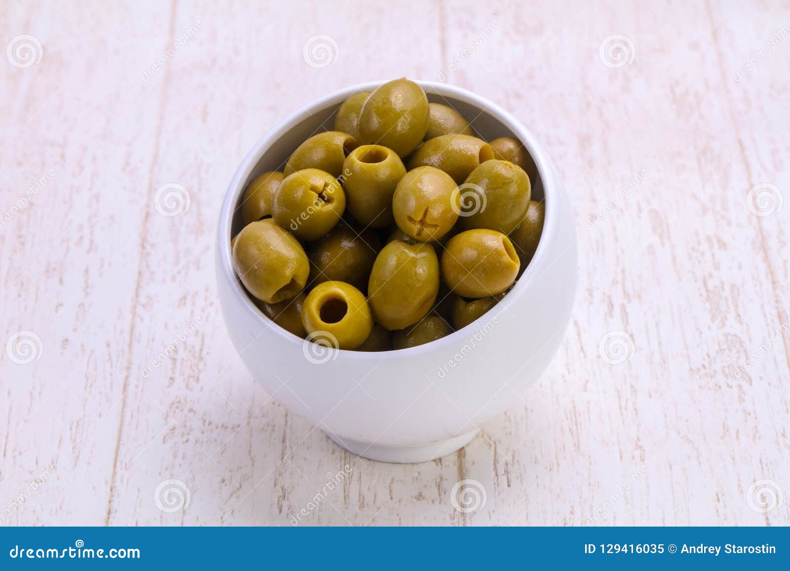 Pickled olives in the bowl stock image. Image of close 129416035
